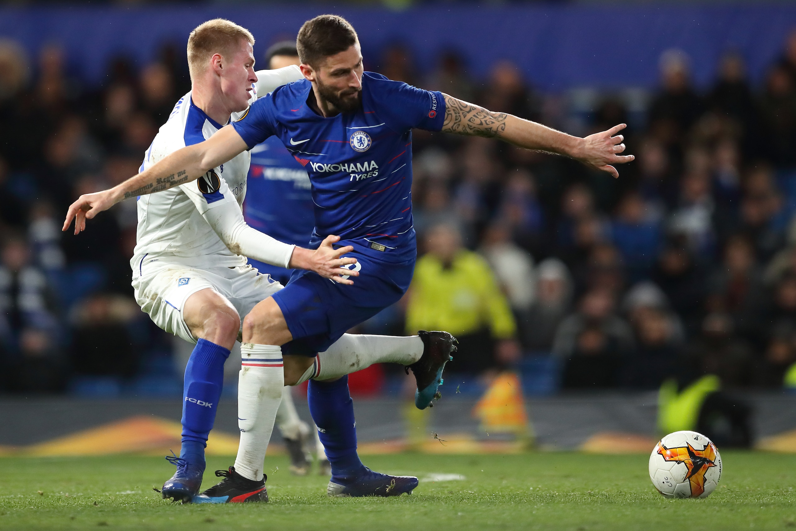LONDON, ENGLAND - MARCH 07: Mykyta Burda of Dynamo Kyiv and Oliver Giroud of Chelsea during the UEFA Europa League Round of 16 First Leg match between Chelsea and Dynamo Kyiv at Stamford Bridge on March 7, 2019 in London, England. (Photo by James Williams