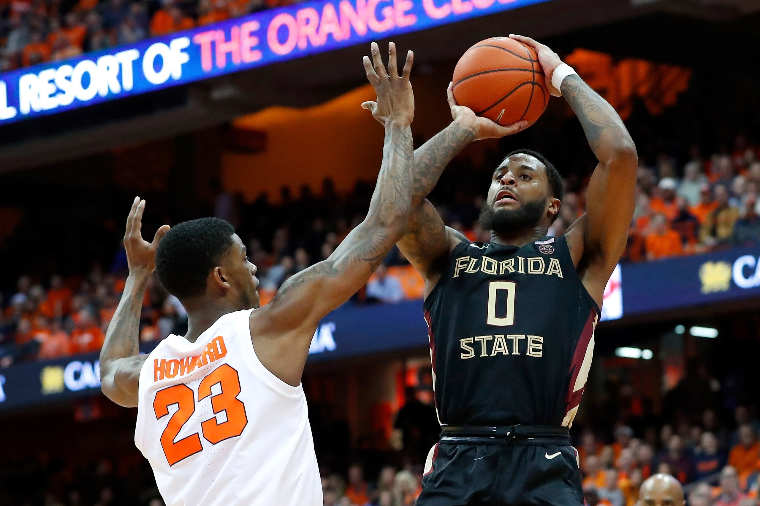 SYRACUSE, NY - FEBRUARY 05:  Phil Cofer #0 of the Florida State Seminoles shoots the ball as Frank Howard #23 of the Syracuse Orange defends during the second half at the Carrier Dome on February 5, 2019 in Syracuse, New York. Florida State defeated Syrac