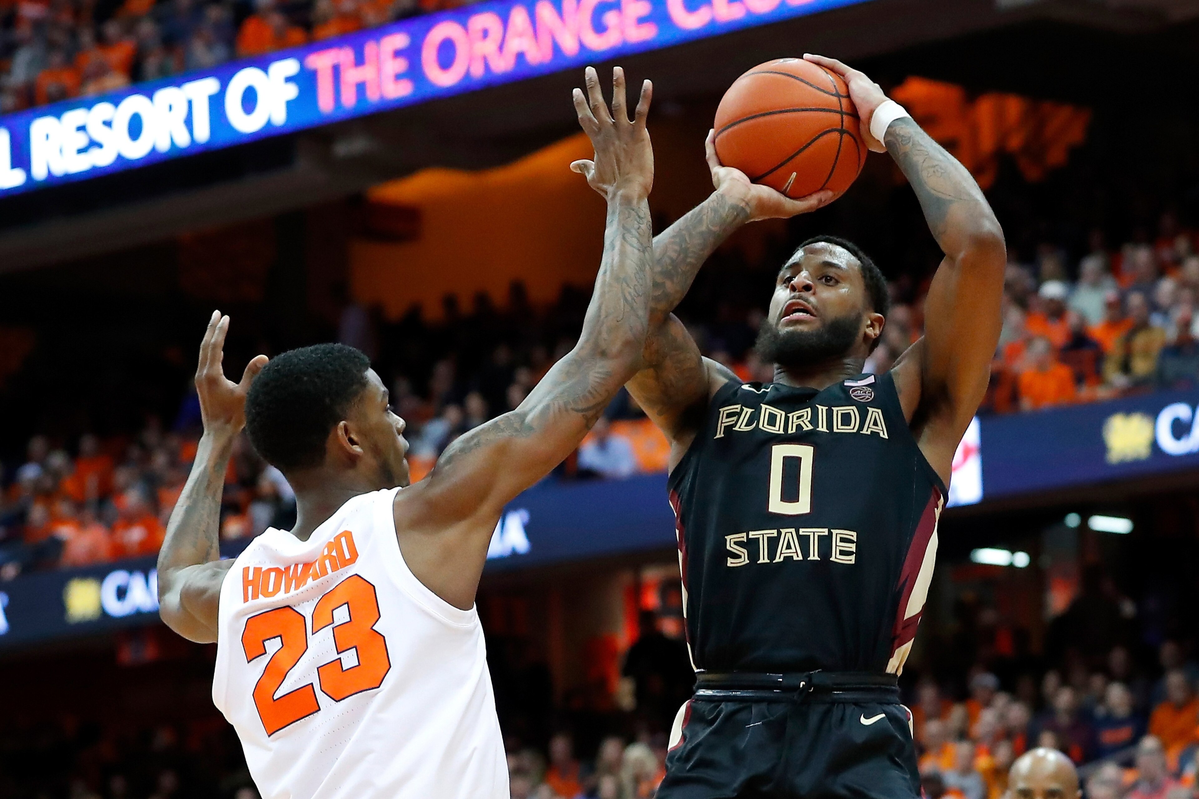 SYRACUSE, NY - FEBRUARY 05:  Phil Cofer #0 of the Florida State Seminoles shoots the ball as Frank Howard #23 of the Syracuse Orange defends during the second half at the Carrier Dome on February 5, 2019 in Syracuse, New York. Florida State defeated Syrac