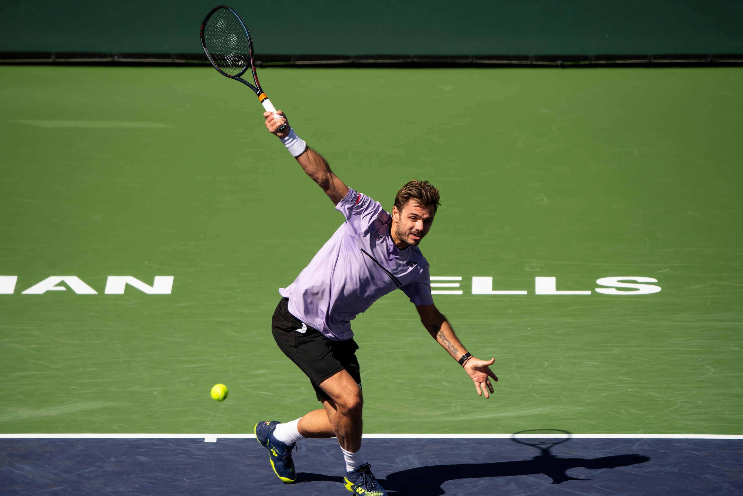 INDIAN WELLS, CALIFORNIA - MARCH 08: Stan Wawrinka of Switzerland in action against Daniel Evans of Great Britain in the first round of the men's singles on March 08, 2019 at the Indian Wells Tennis Garden in Indian Wells, California. (Photo by TPN/Getty 