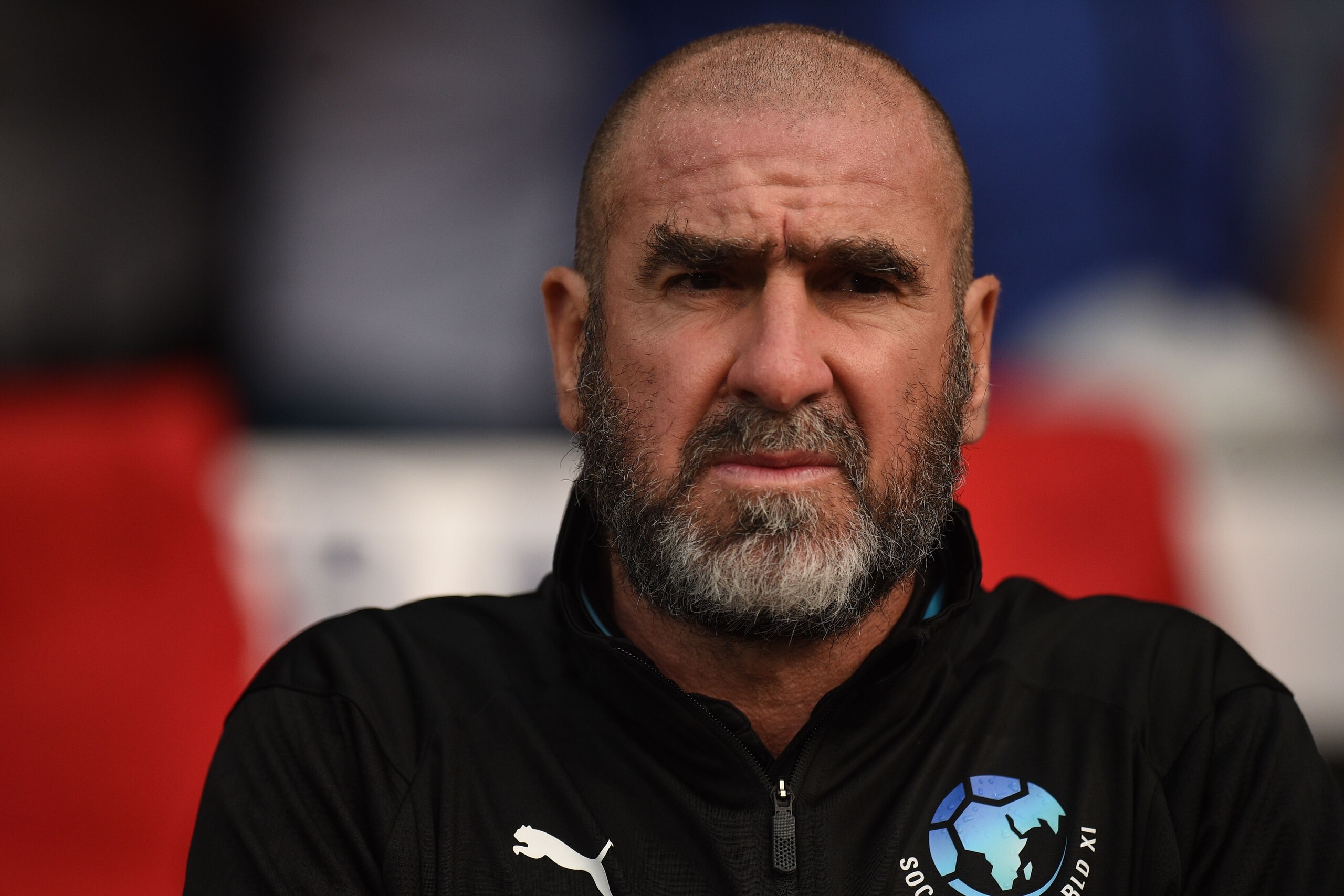 Former French international Eric Cantona looks on before an England V Soccer Aid World XI charity football match for Soccer Aid for Unicef at Old Trafford in Manchester, northwest England on June 10, 2018. (Photo by Oli SCARFF / AFP)        (Photo credit 