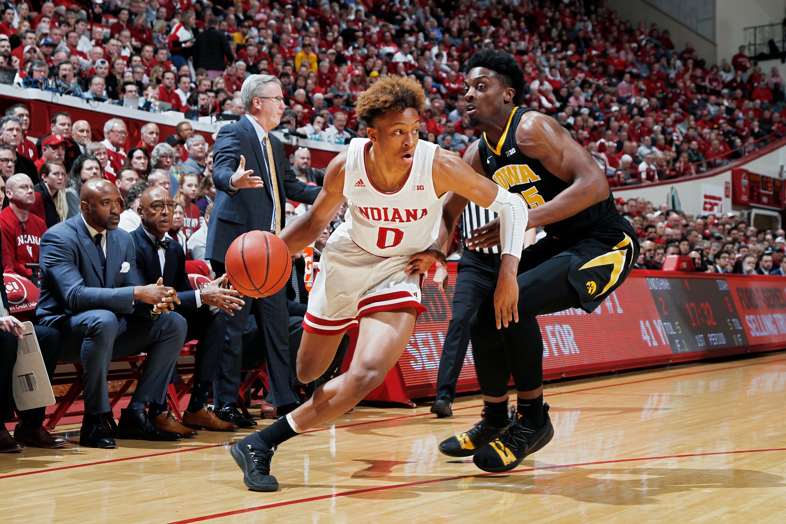 BLOOMINGTON, IN - FEBRUARY 07: Romeo Langford #0 of the Indiana Hoosiers drives against Tyler Cook #25 of the Iowa Hawkeyes in the first half of the game at Assembly Hall on February 7, 2019 in Bloomington, Indiana. Iowa won 77-72. (Photo by Joe Robbins/G