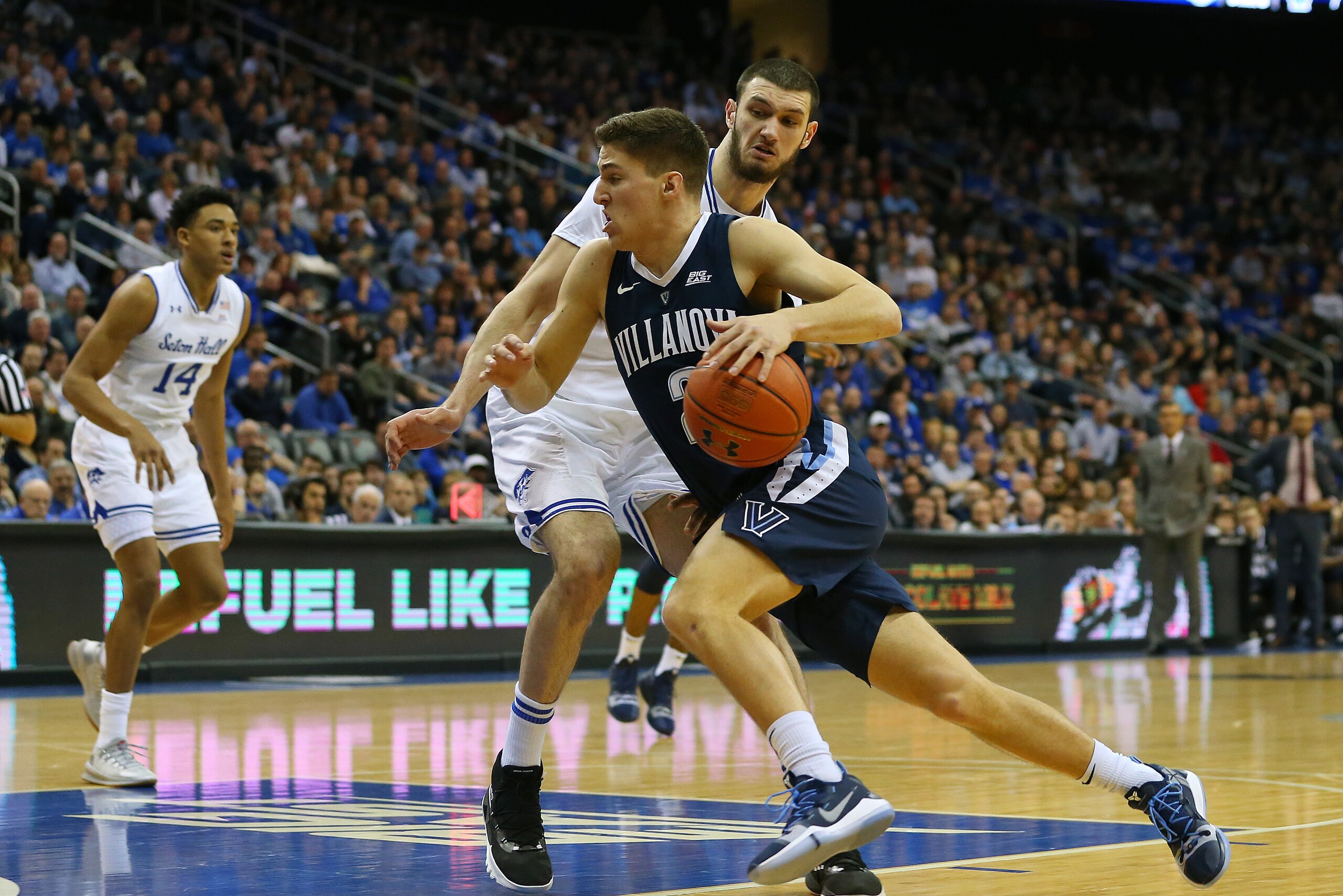 NEWARK, NJ - MARCH 09: Collin Gillespie #2 of the Villanova Wildcats in action against Sandro Mamukelashvili #23 of the Seton Hall Pirates during a college basketball game at Prudential Center on March 9, 2019 in Newark, New Jersey. Seton Hall defeated Vi
