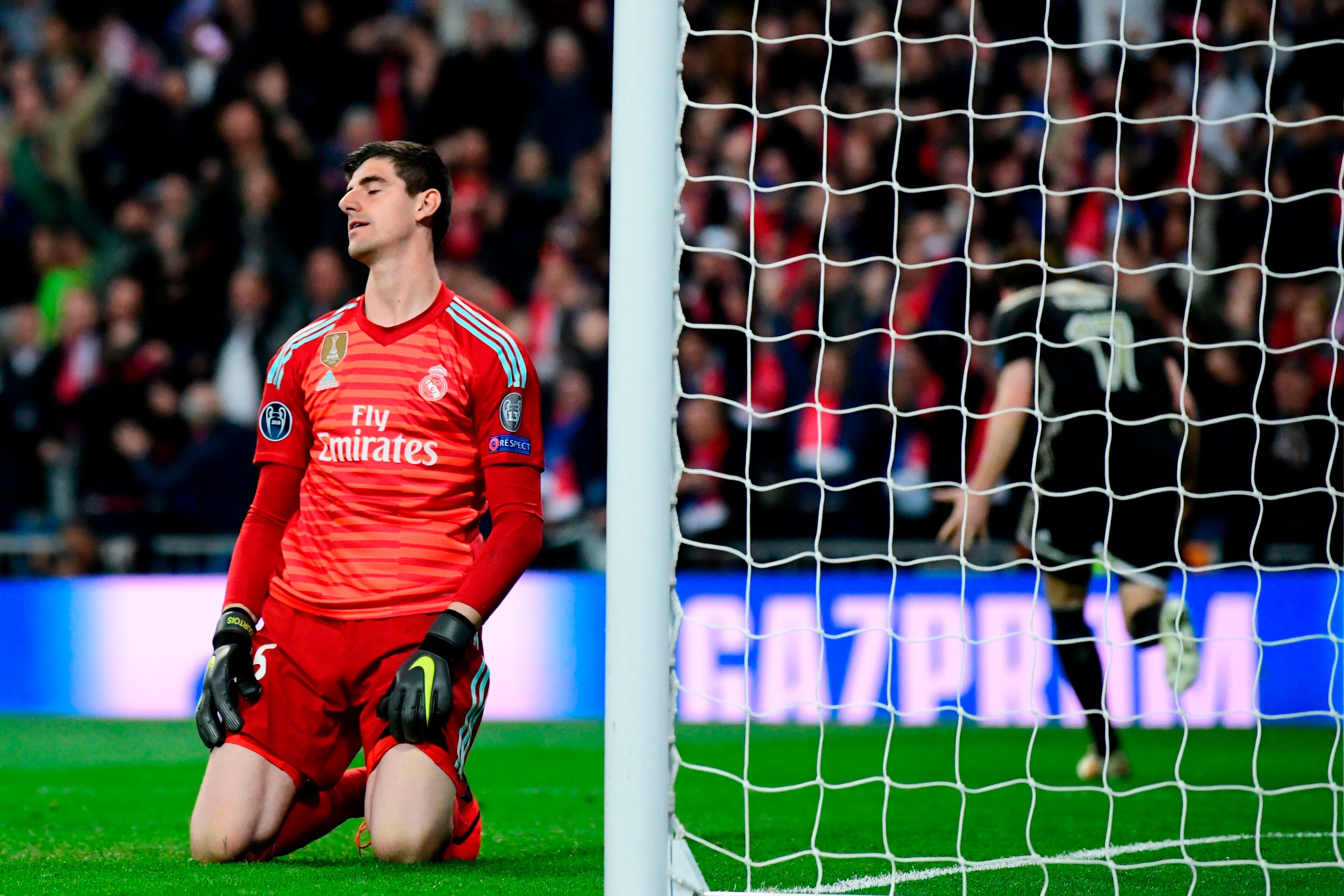 Real Madrid's Belgian goalkeeper Thibaut Courtois reacts as he concedes a fourth goal during the UEFA Champions League round of 16 second leg football match between Real Madrid CF and Ajax at the Santiago Bernabeu stadium in Madrid on March 5, 2019. (Phot Real Madrid's Belgian goalkeeper Thibaut Courtois reacts as he concedes a fourth goal during the UEFA Champions League round of 16 second leg football match between Real Madrid CF and Ajax at the Santiago Bernabeu stadium in Madrid on March 5, 2019. (Phot