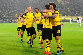 DORTMUND, GERMANY - MARCH 09: Marco Reus of Borussia Dortmund celebrates after scoring his team's first goal with team mates during the Bundesliga match between Borussia Dortmund and VfB Stuttgart at Signal Iduna Park on March 9, 2019 in Dortmund, Germany