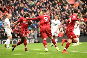 LIVERPOOL, ENGLAND - MARCH 10: Roberto Firmino of Liverpool celebrates with Sadio Mane of Liverpool after scoring his sides first goal during the Premier League match between Liverpool FC and Burnley FC at Anfield on March 10, 2019 in Liverpool, United Ki