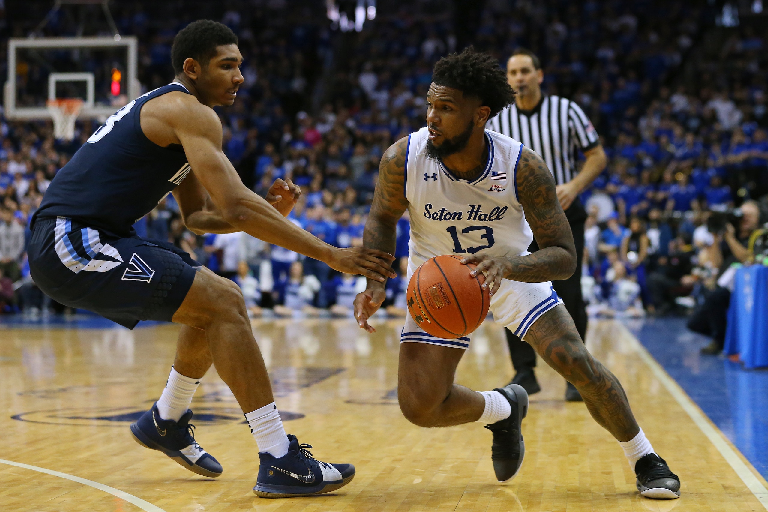 NEWARK, NJ - MARCH 09: Myles Powell #13 of the Seton Hall Pirates in action against Jermaine Samuels #23 of the Villanova Wildcats during a college basketball game at Prudential Center on March 9, 2019 in Newark, New Jersey. Seton Hall defeated Villanova 
