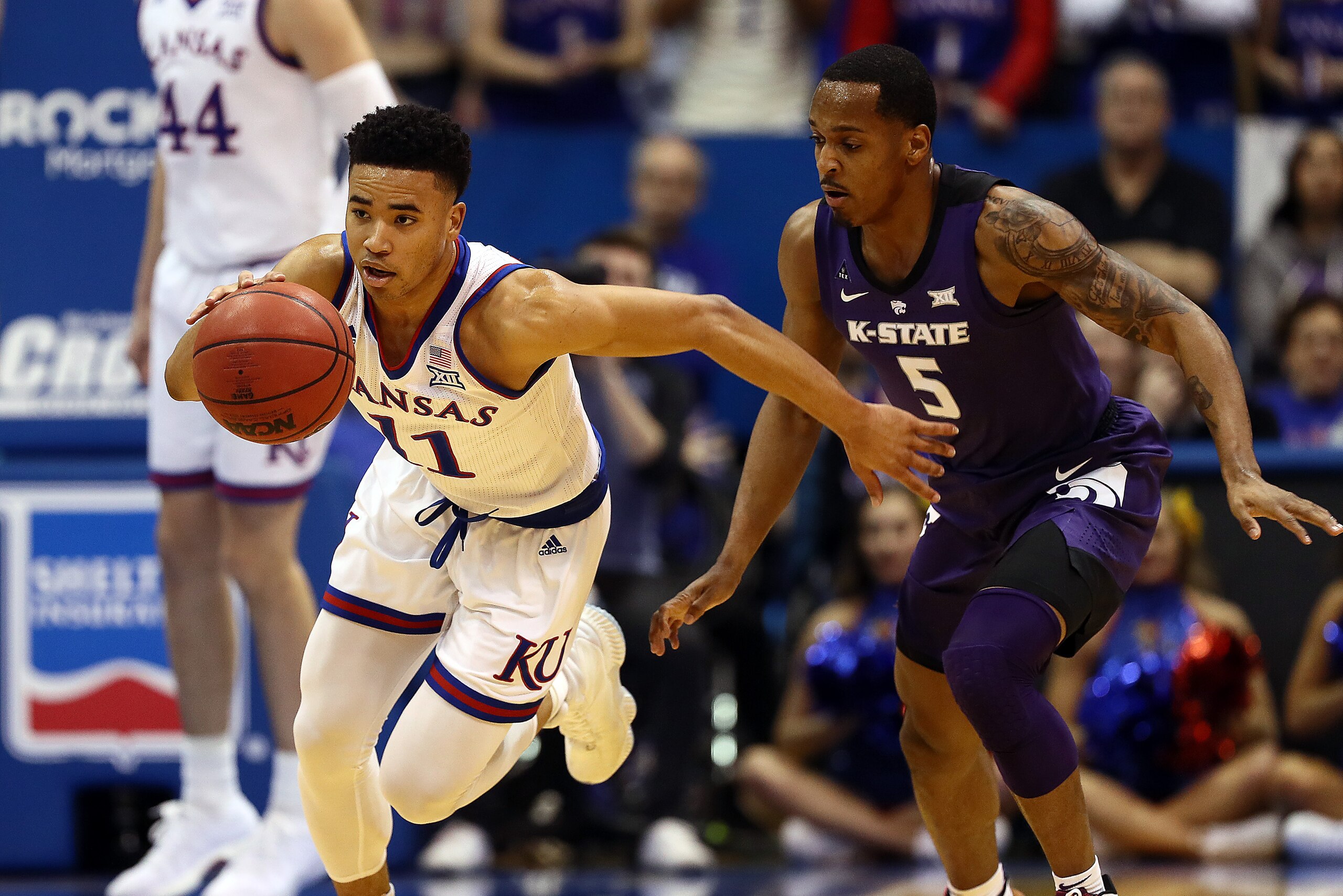 LAWRENCE, KANSAS - FEBRUARY 25: Devon Dotson #11 of the Kansas Jayhawks drives on a fast break as Barry Brown Jr. #5 of the Kansas State Wildcats defends during the game at Allen Fieldhouse on February 25, 2019 in Lawrence, Kansas. (Photo by Jamie Squire LAWRENCE, KANSAS - FEBRUARY 25: Devon Dotson #11 of the Kansas Jayhawks drives on a fast break as Barry Brown Jr. #5 of the Kansas State Wildcats defends during the game at Allen Fieldhouse on February 25, 2019 in Lawrence, Kansas. (Photo by Jamie Squire
