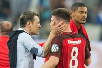 GELSENKIRCHEN, GERMANY - APRIL 18: Head coach Niko Kovac of Frankfurt speaks with Luka Jovic of Frankfurt after the DFB Cup semi final match between FC Schalke 04 and Eintracht Frankfurt at Veltins-Arena on April 18, 2018 in Gelsenkirchen, Germany. (Photo