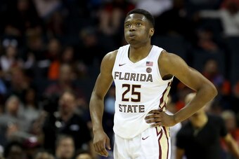 CHARLOTTE, NORTH CAROLINA - MARCH 14: Mfiondu Kabengele #25 of the Florida State Seminoles reacts to a play against the Virginia Tech Hokies during their game in the quarterfinal round of the 2019 Men's ACC Basketball Tournament at Spectrum Center on Marc