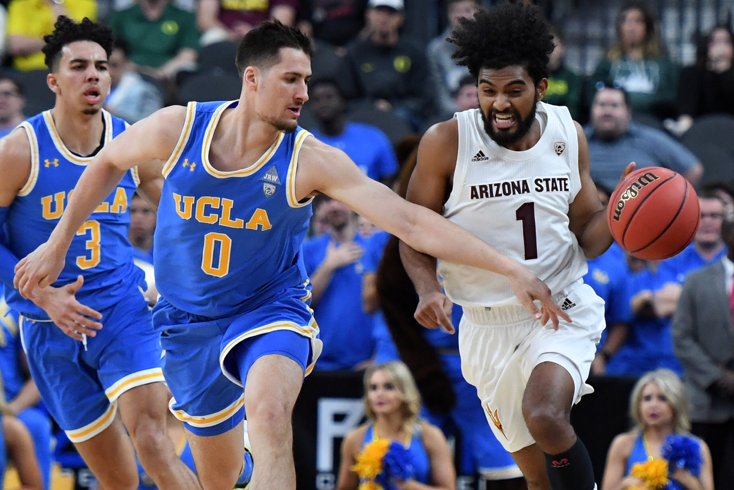LAS VEGAS, NEVADA - MARCH 14:  Remy Martin #1 of the Arizona State Sun Devils brings the ball up the court against Alex Olesinski #0 of the UCLA Bruins during a quarterfinal game of the Pac-12 basketball tournament at T-Mobile Arena on March 14, 2019 in L