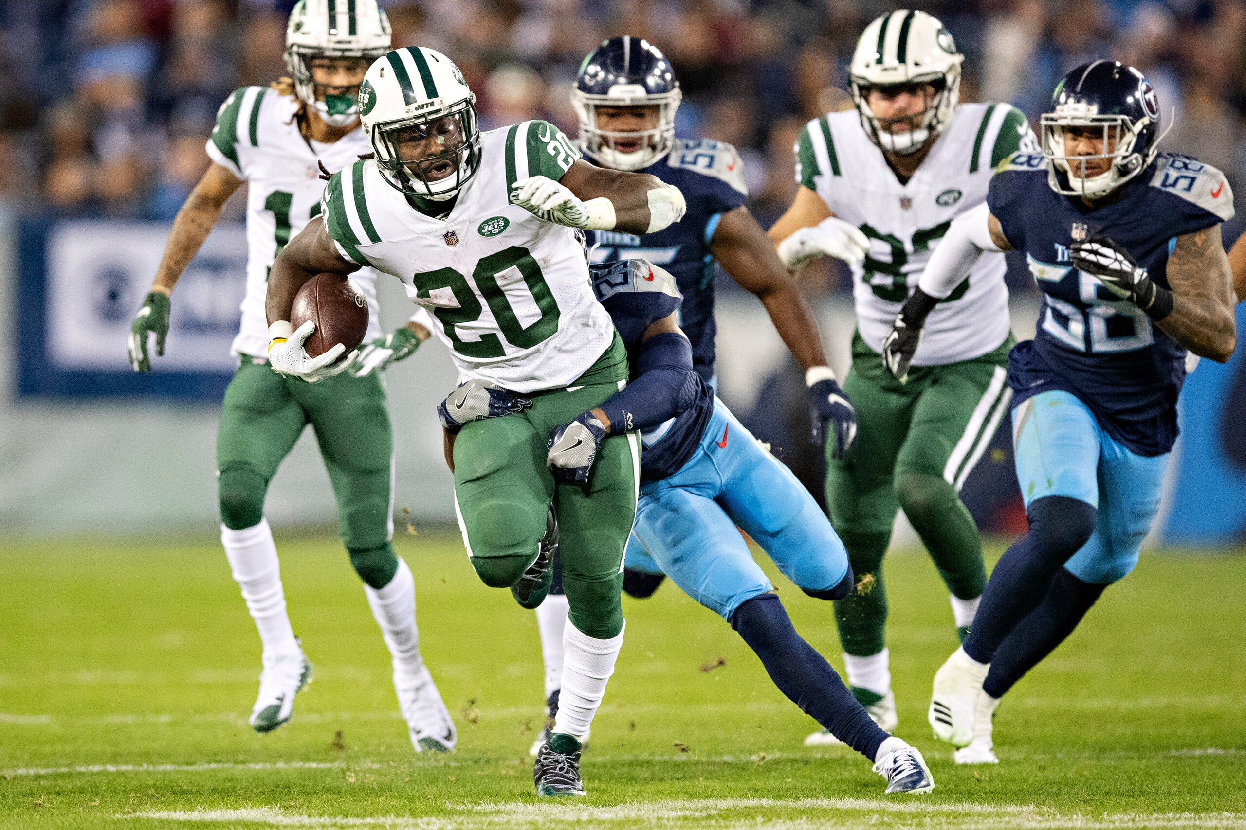 NASHVILLE, TN - DECEMBER 2:  Isaiah Crowell #20 of the New York Jets runs the ball and is tackled by Adoree Jackson #25 of the Tennessee Titans at Nissan Stadium on December 2, 2018 in Nashville,Tennessee.  The Titans defeated the Jets 26-22.   (Photo by 