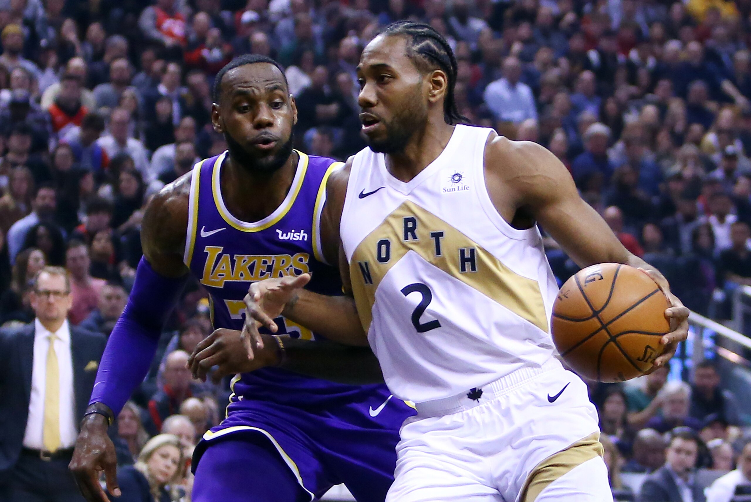 TORONTO, ON - MARCH 14:  Kawhi Leonard #2 of the Toronto Raptors dribbles the ball as LeBron James #23 of the Los Angeles Lakers defends during the first half of an NBA game at Scotiabank Arena on March 14, 2019 in Toronto, Canada.  NOTE TO USER: User exp