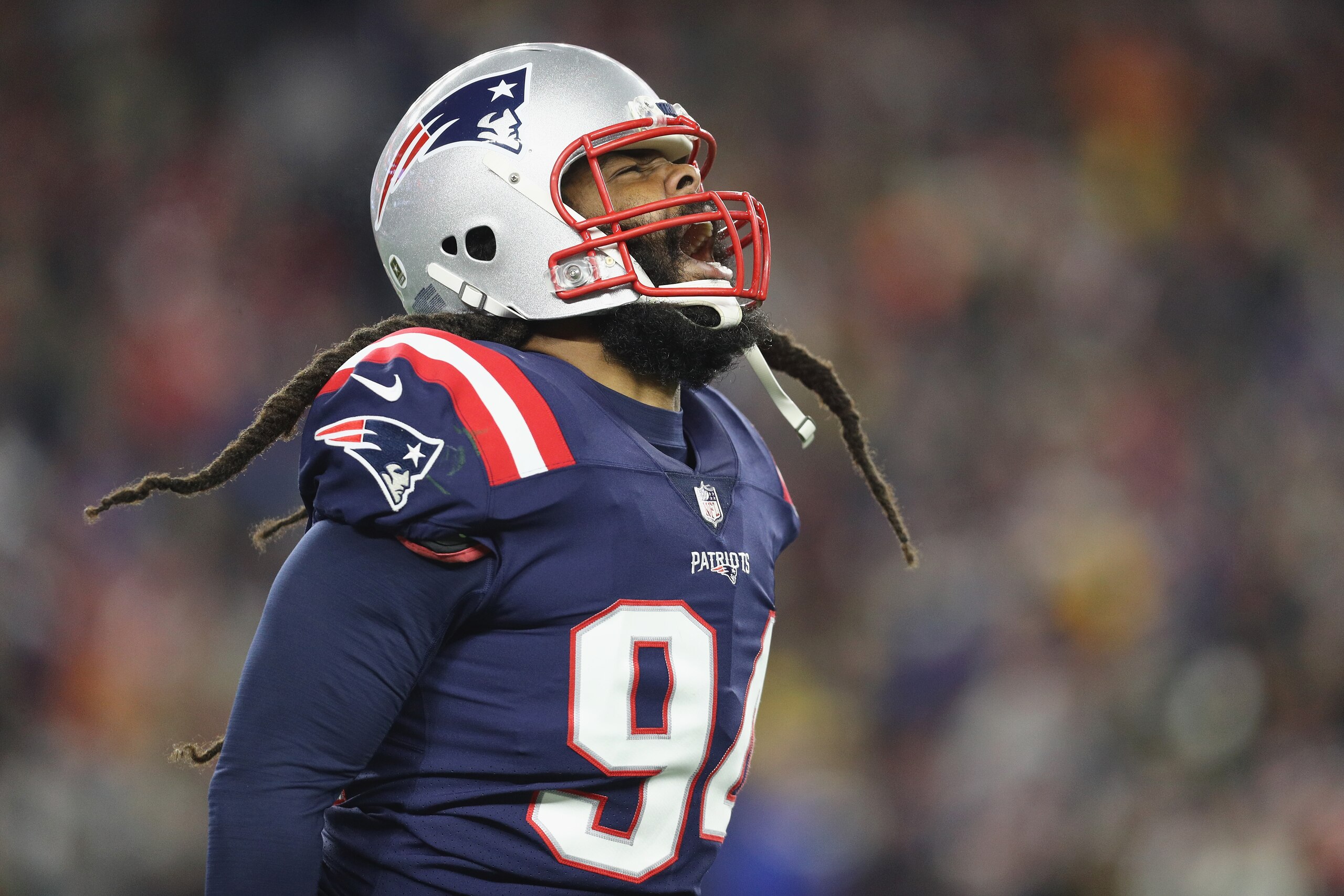 FOXBOROUGH, MA - NOVEMBER 04:  Adrian Clayborn #94 of the New England Patriots celebrates after sacking Aaron Rodgers #12 of the Green Bay Packers (not pictured) during the second half at Gillette Stadium on November 4, 2018 in Foxborough, Massachusetts. 