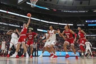 CHICAGO, ILLINOIS - MARCH 14: Evan Fitzner #55 of the Indiana Hoosiers rebounds over Andre Wesson #24 of the Ohio State Buckeyes at the United Center on March 14, 2019 in Chicago, Illinois. Ohio State defeated Indiana 79-75. (Photo by Jonathan Daniel/Gett