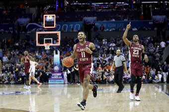 CHARLOTTE, NORTH CAROLINA - MARCH 15: David Nichols #11 of the Florida State Seminoles reacts to their 69-59 victory over the Virginia Cavaliers in the semifinals of the 2019 Men's ACC Basketball Tournament at Spectrum Center on March 15, 2019 in Charlott