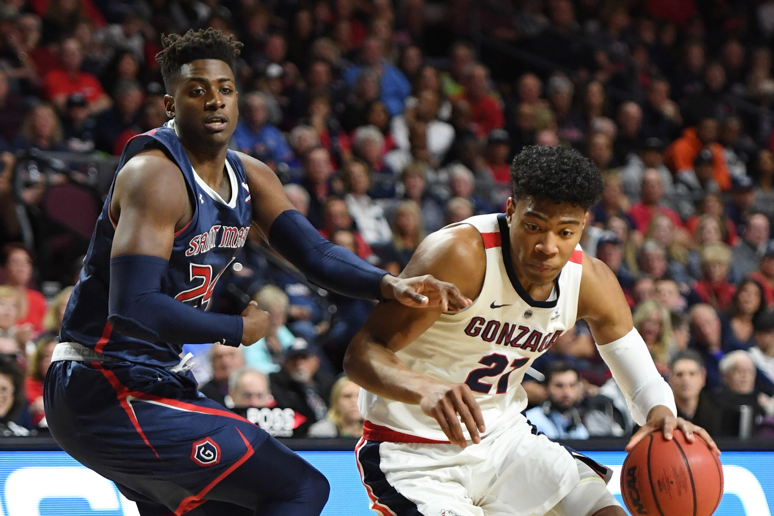 LAS VEGAS, NEVADA - MARCH 12:  Rui Hachimura #21 of the Gonzaga Bulldogs drives against Malik Fitts #24 of the Saint Mary's Gaels during the championship game of the West Coast Conference basketball tournament at the Orleans Arena on March 12, 2019 in Las