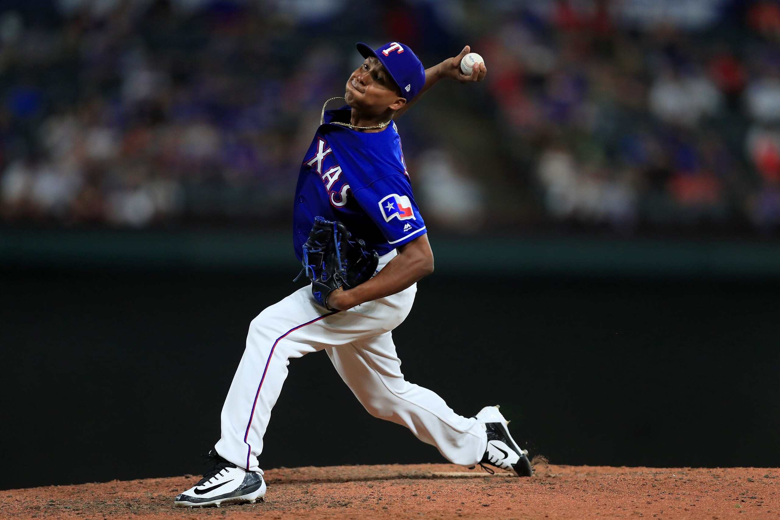 ARLINGTON, TX - AUGUST 29:  Jose Leclerc #62 of the Texas Rangers pitches against the Los Angeles Dodgers in the top of the ninth inning at Globe Life Park in Arlington on August 29, 2018 in Arlington, Texas.  (Photo by Tom Pennington/Getty Images)