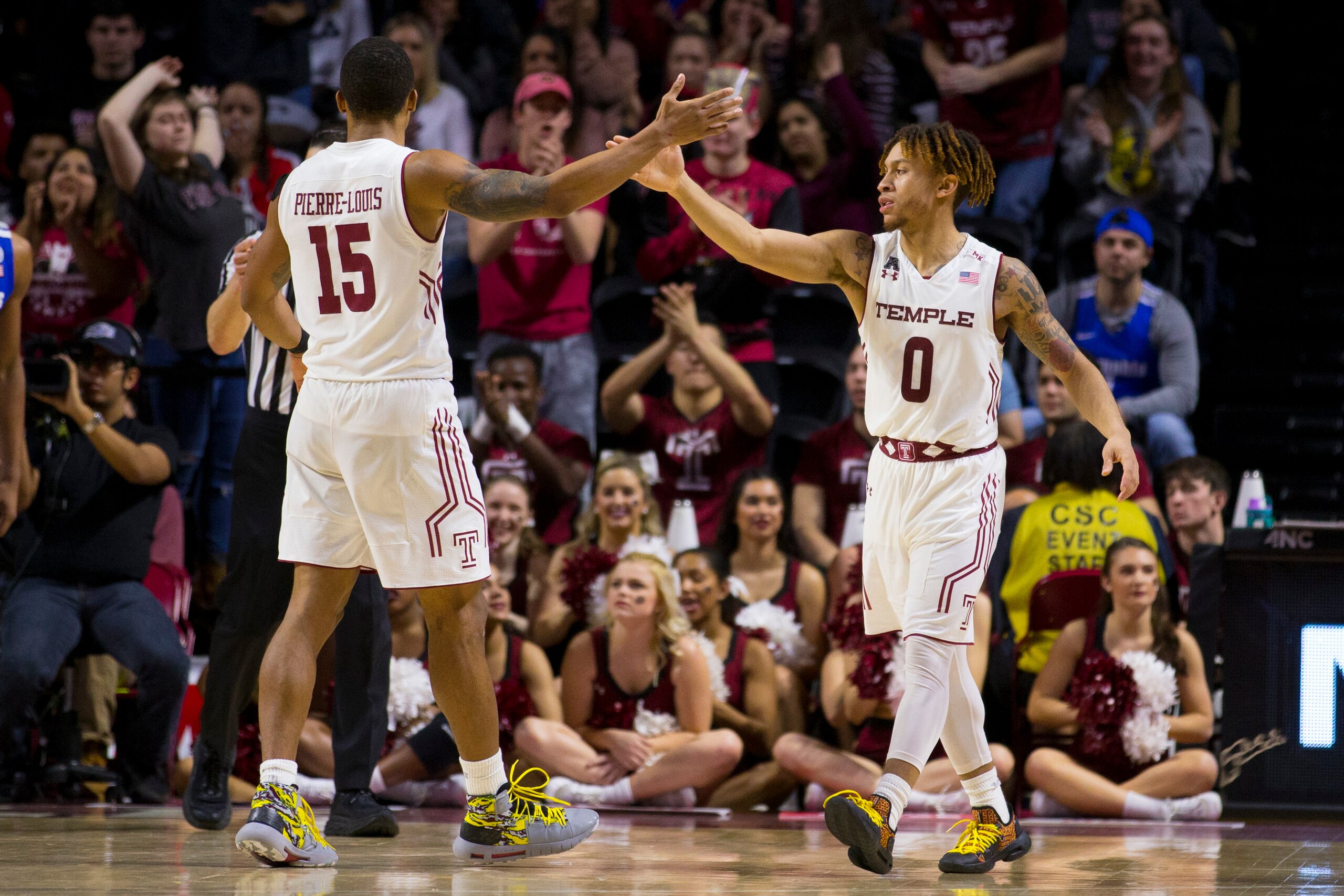 PHILADELPHIA, PA - JANUARY 24: Nate Pierre-Louis #15 of the Temple Owls high fives Alani Moore II #0 against the Memphis Tigers at the Liacouras Center on January 24, 2019 in Philadelphia, Pennsylvania. (Photo by Mitchell Leff/Getty Images)