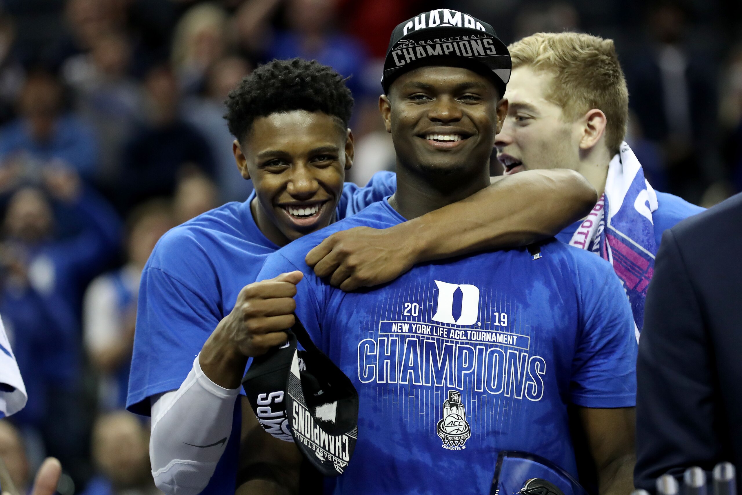 CHARLOTTE, NORTH CAROLINA - MARCH 16: Teammates RJ Barrett #5 and Zion Williamson #1 of the Duke Blue Devils react after defeating the Florida State Seminoles 73-63 in the championship game of the 2019 Men's ACC Basketball Tournament at Spectrum Center on