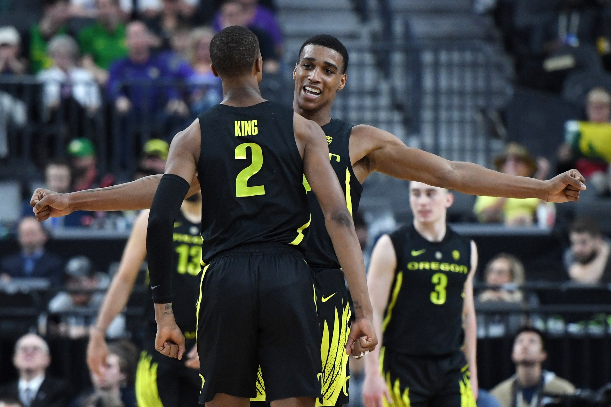 LAS VEGAS, NEVADA - MARCH 16:  Louis King #2 and Kenny Wooten #14 of the Oregon Ducks celebrate during the championship game of the Pac-12 basketball tournament against the Washington Huskies at T-Mobile Arena on March 16, 2019 in Las Vegas, Nevada. The D