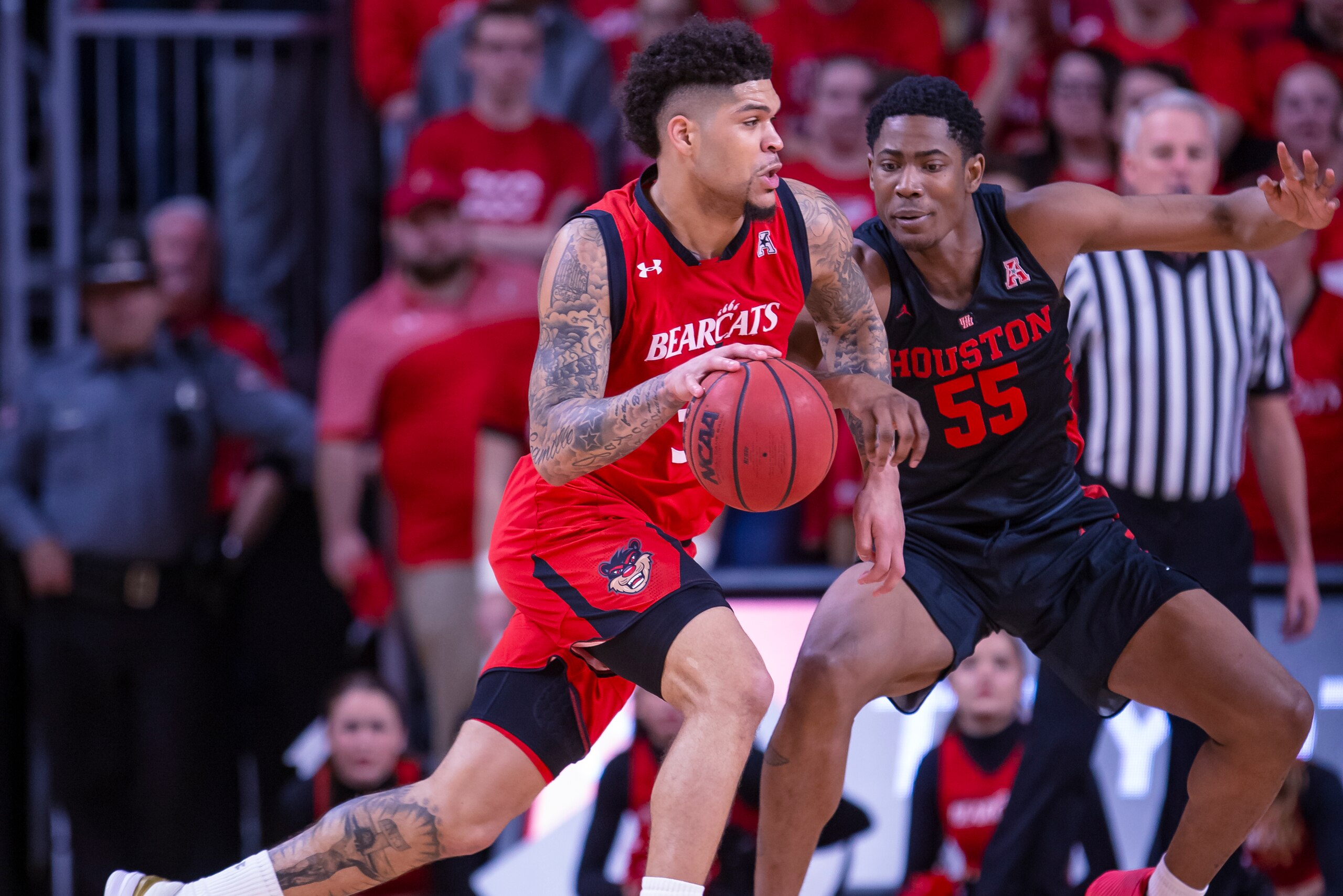 CINCINNATI, OH - MARCH 10: Jarron Cumberland #34 of the Cincinnati Bearcats dribbles the ball against Brison Gresham #55 of the Houston Cougars at Fifth Third Arena on March 10, 2019 in Cincinnati, Ohio. (Photo by Michael Hickey/Getty Images)