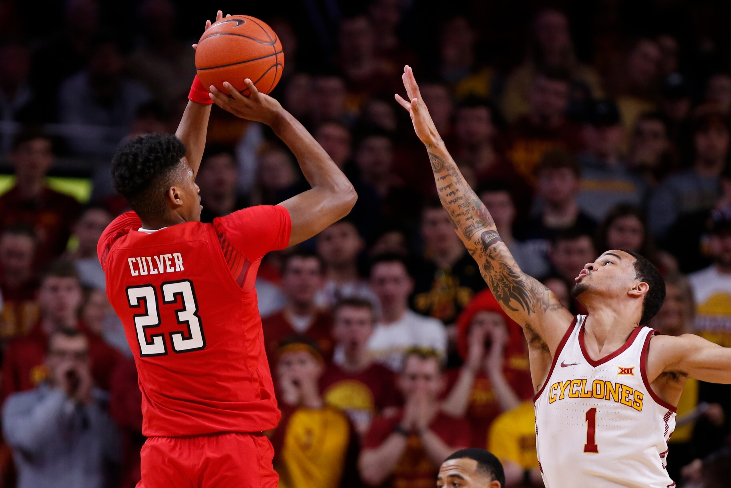 AMES, IA - MARCH 9: Jarrett Culver #23 of the Texas Tech Red Raiders takes a shot as Nick Weiler-Babb #1 of the Iowa State Cyclones blocks in the first half of play at Hilton Coliseum on March 9, 2019 in Ames, Iowa. The Texas Tech Red Raiders won 80-73 ov