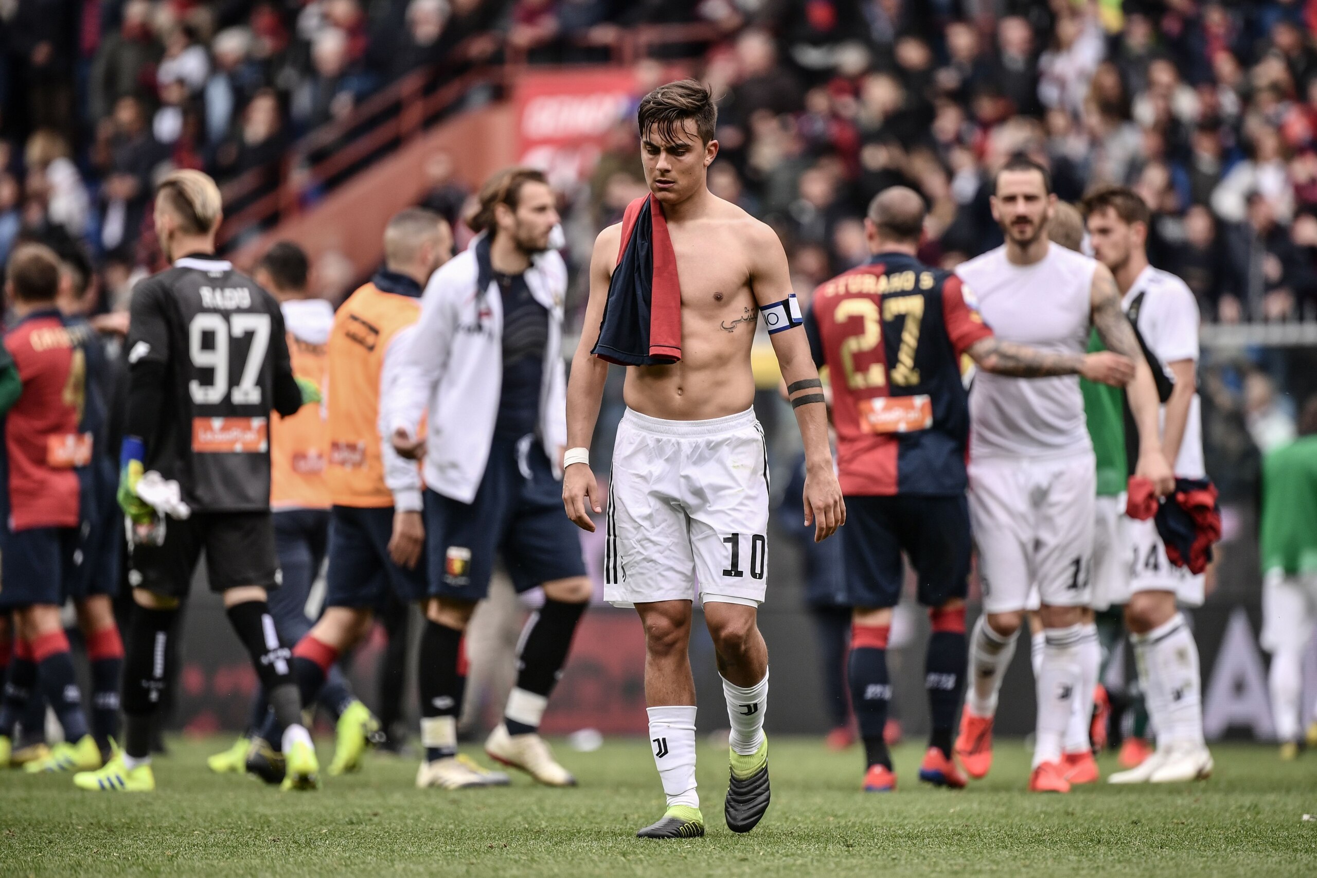Juventus' Argentine forward Paulo Dybala (C) leaves the pitch at the end of the Italian Serie A football Match Genoa vs Juventus on March 17, 2019 at the Luigi-Ferraris stadium in Genoa. (Photo by Marco BERTORELLO / AFP) (Photo credit should read M Juventus' Argentine forward Paulo Dybala (C) leaves the pitch at the end of the Italian Serie A football Match Genoa vs Juventus on March 17, 2019 at the Luigi-Ferraris stadium in Genoa. (Photo by Marco BERTORELLO / AFP) (Photo credit should read M