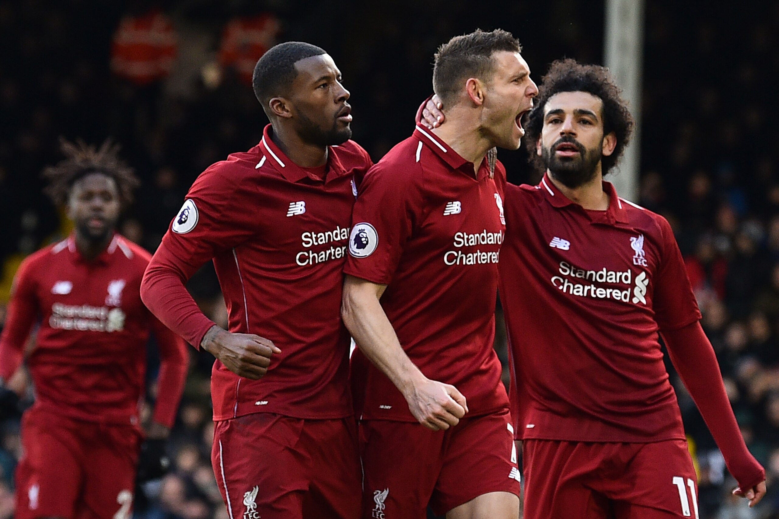 Liverpool's English midfielder James Milner (C) celebrates scoring the team's second goal during the English Premier League football match between Fulham and Liverpool at Craven Cottage in London on March 17, 2019. (Photo by Glyn KIRK / AFP) / RESTRICTED Liverpool's English midfielder James Milner (C) celebrates scoring the team's second goal during the English Premier League football match between Fulham and Liverpool at Craven Cottage in London on March 17, 2019. (Photo by Glyn KIRK / AFP) / RESTRICTED