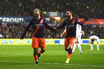 SWANSEA, WALES - MARCH 16: Sergio Aguero of Manchester City celebrates after scoring his team's third goal with Bernardo Silva of Manchester City during the FA Cup Quarter Final match between Swansea City and Manchester City at Liberty Stadium on March 16