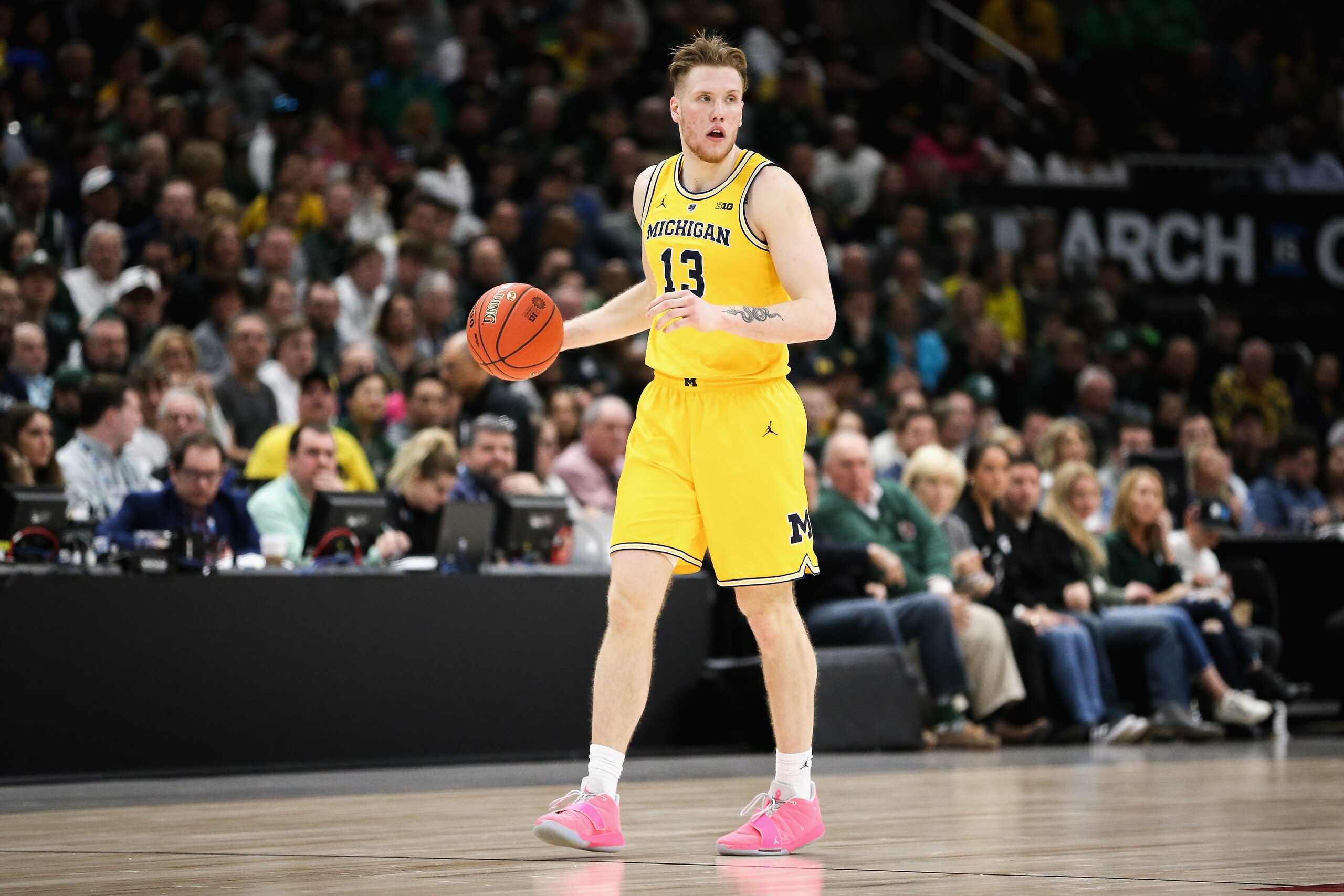 CHICAGO, ILLINOIS - MARCH 17:  Ignas Brazdeikis #13 of the Michigan Wolverines dribbles the ball in the second half against the Michigan State Spartans during the championship game of the Big Ten Basketball Tournament at United Center on March 17, 2019 in