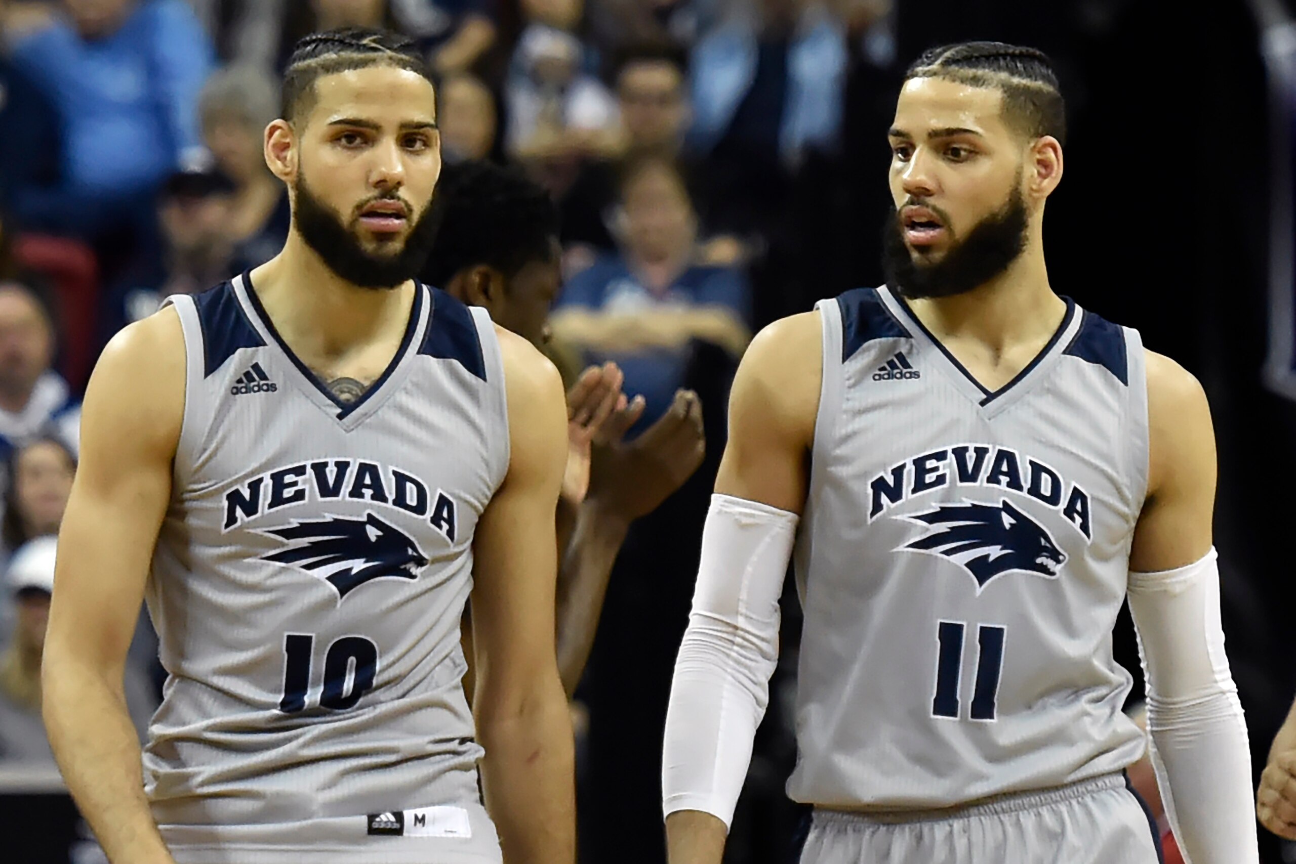 LAS VEGAS, NEVADA - MARCH 15:  Caleb Martin #10 and Cody Martin #11 of the Nevada Wolf Pack walk up court during a semifinal game of the Mountain West Conference basketball tournament against the San Diego State Aztecs at the Thomas & Mack Center on March