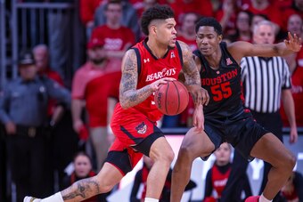 CINCINNATI, OH - MARCH 10: Jarron Cumberland #34 of the Cincinnati Bearcats dribbles the ball against Brison Gresham #55 of the Houston Cougars at Fifth Third Arena on March 10, 2019 in Cincinnati, Ohio. (Photo by Michael Hickey/Getty Images)
