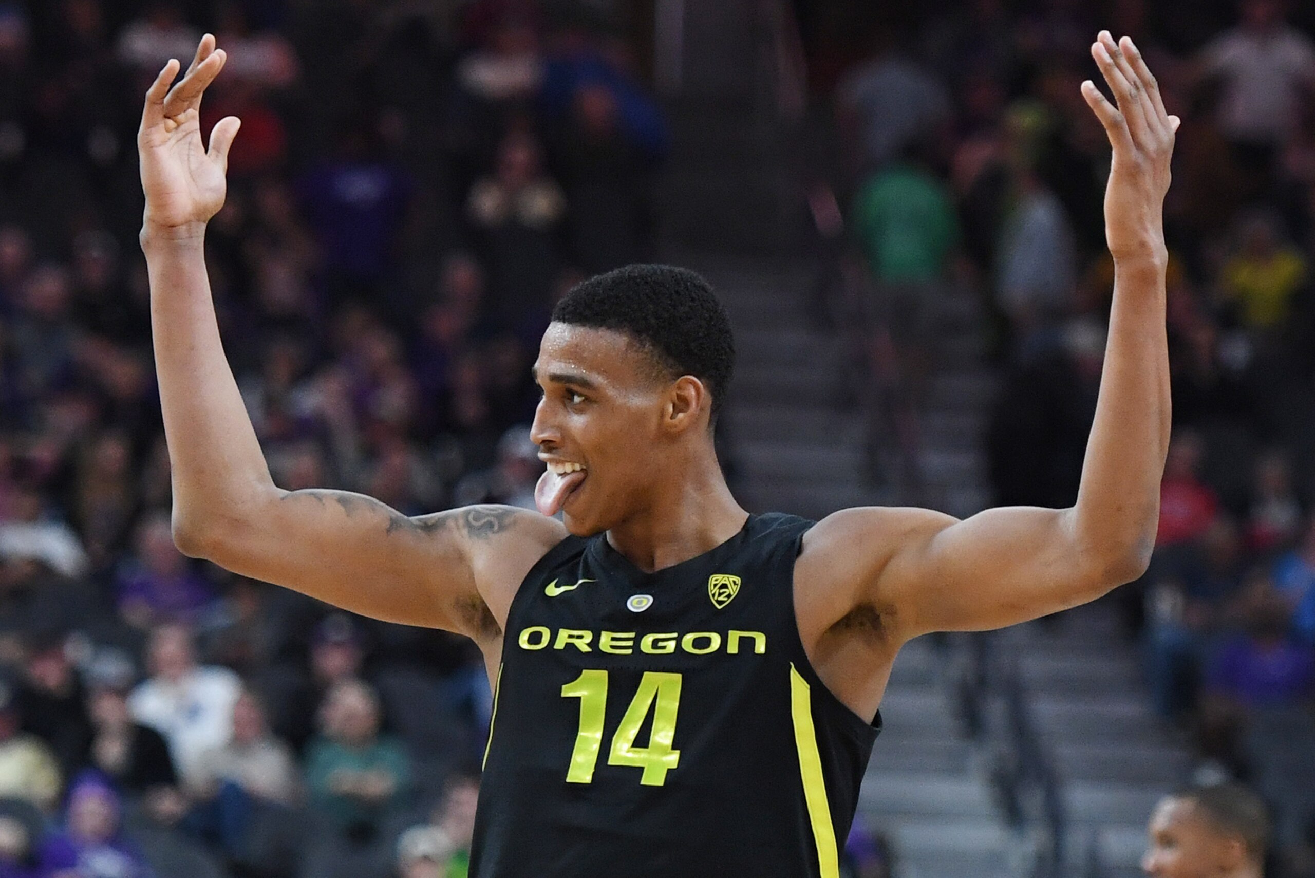LAS VEGAS, NEVADA - MARCH 16:  Kenny Wooten #14 of the Oregon Ducks celebrates on the court after a Washington Huskies turnover during the championship game of the Pac-12 basketball tournament at T-Mobile Arena on March 16, 2019 in Las Vegas, Nevada. The 