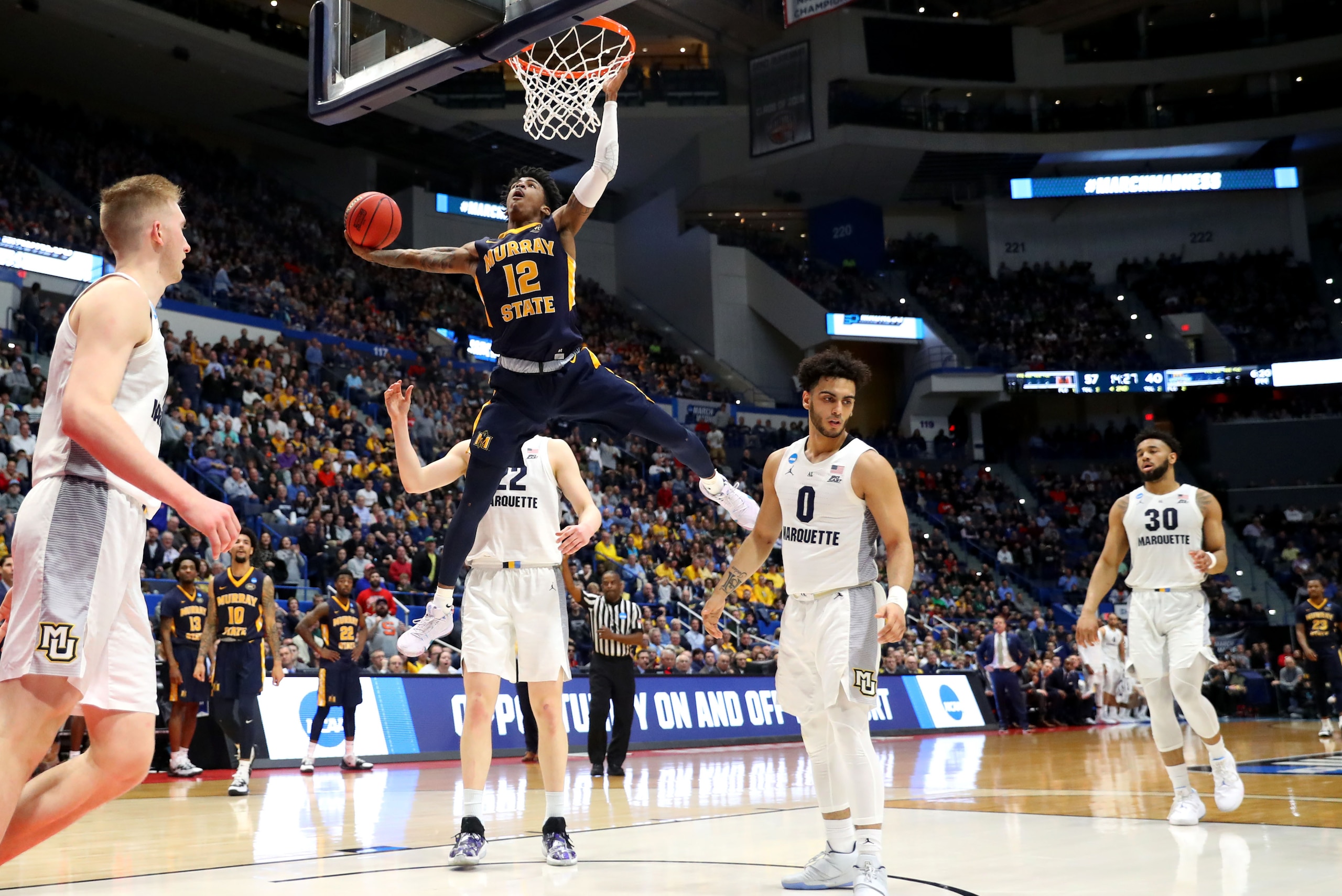 HARTFORD, CONNECTICUT - MARCH 21:  Ja Morant #12 of the Murray State Racers dunks the ball during the second half of the first round game of the 2019 NCAA Men's Basketball Tournament against the Marquette Golden Eagles at XL Center on March 21, 2019 in Ha
