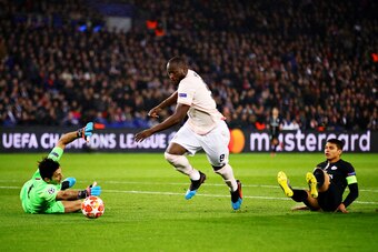 PARIS, FRANCE - MARCH 06: Romelu Lukaku of Manchester United rounds Gianluigi Buffon of Paris Saint-Germain to score his sides first goal during the UEFA Champions League Round of 16 Second Leg match between Paris Saint-Germain and Manchester United at Pa
