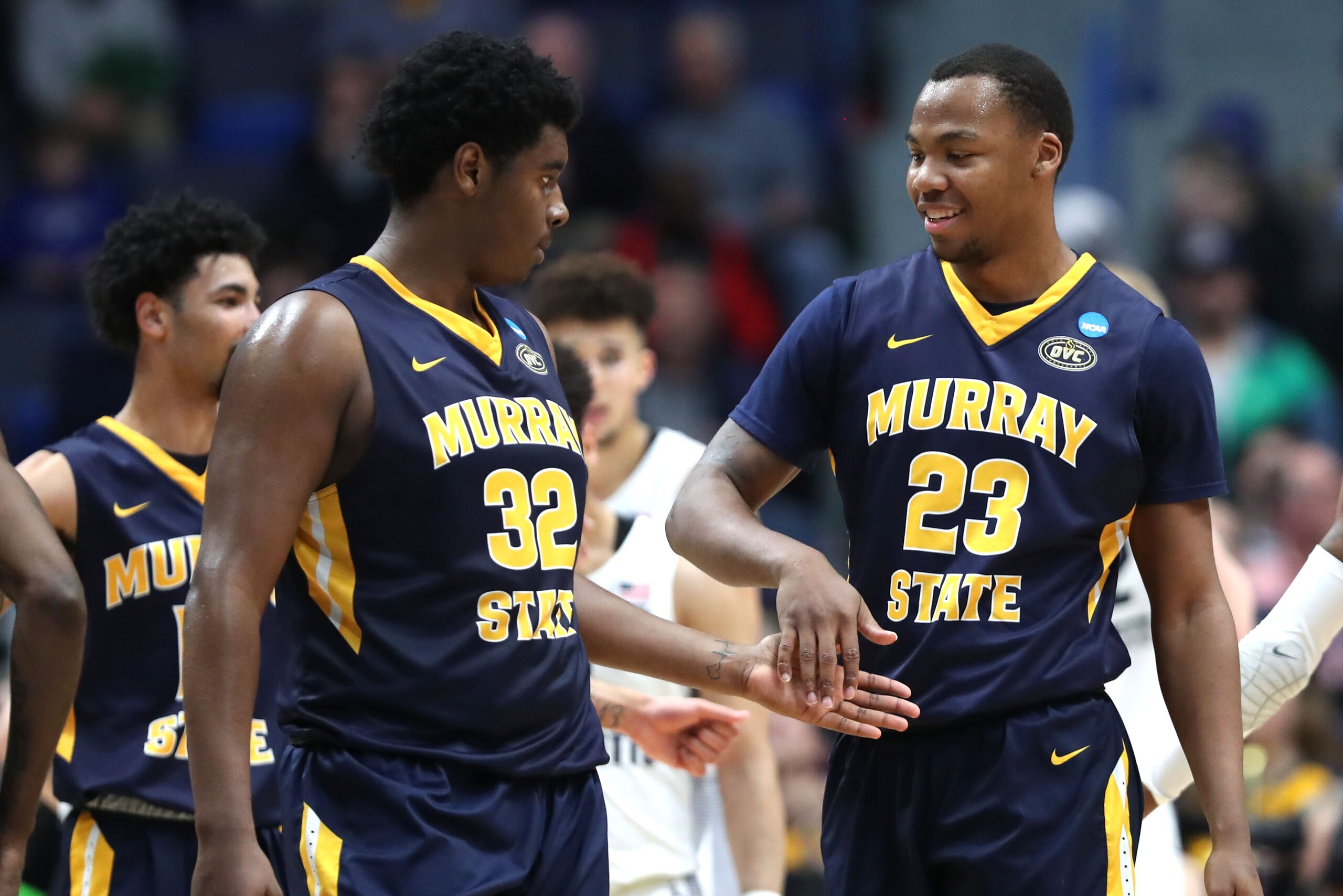 HARTFORD, CONNECTICUT - MARCH 21:  Darnell Cowart #32 and KJ Williams #23 of the Murray State Racers celebrate while playing in the second half of the first round game of the 2019 NCAA Men's Basketball Tournament against the Marquette Golden Eagles at XL 
