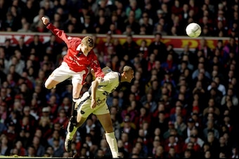 11 May 1997:  Ole Gunnar Solskjaer (left) of Manchester United and Rio Ferdinand of West Ham United jump for the ball during an FA Carling Premiership match at Old Trafford in Manchester, England. Manchester United won the match 2-0. \ Mandatory Credit: B