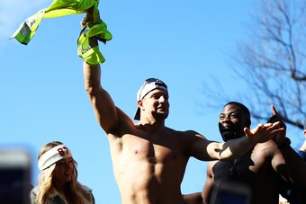 BOSTON, MASSACHUSETTS - FEBRUARY 05: Rob Gronkowski #87 of the New England Patriots waves a high-vis vest around his head as the New England Patriots Victory Parade passes along Tremont Street on February 05, 2019 in Boston, Massachusetts. (Photo by Omar 
