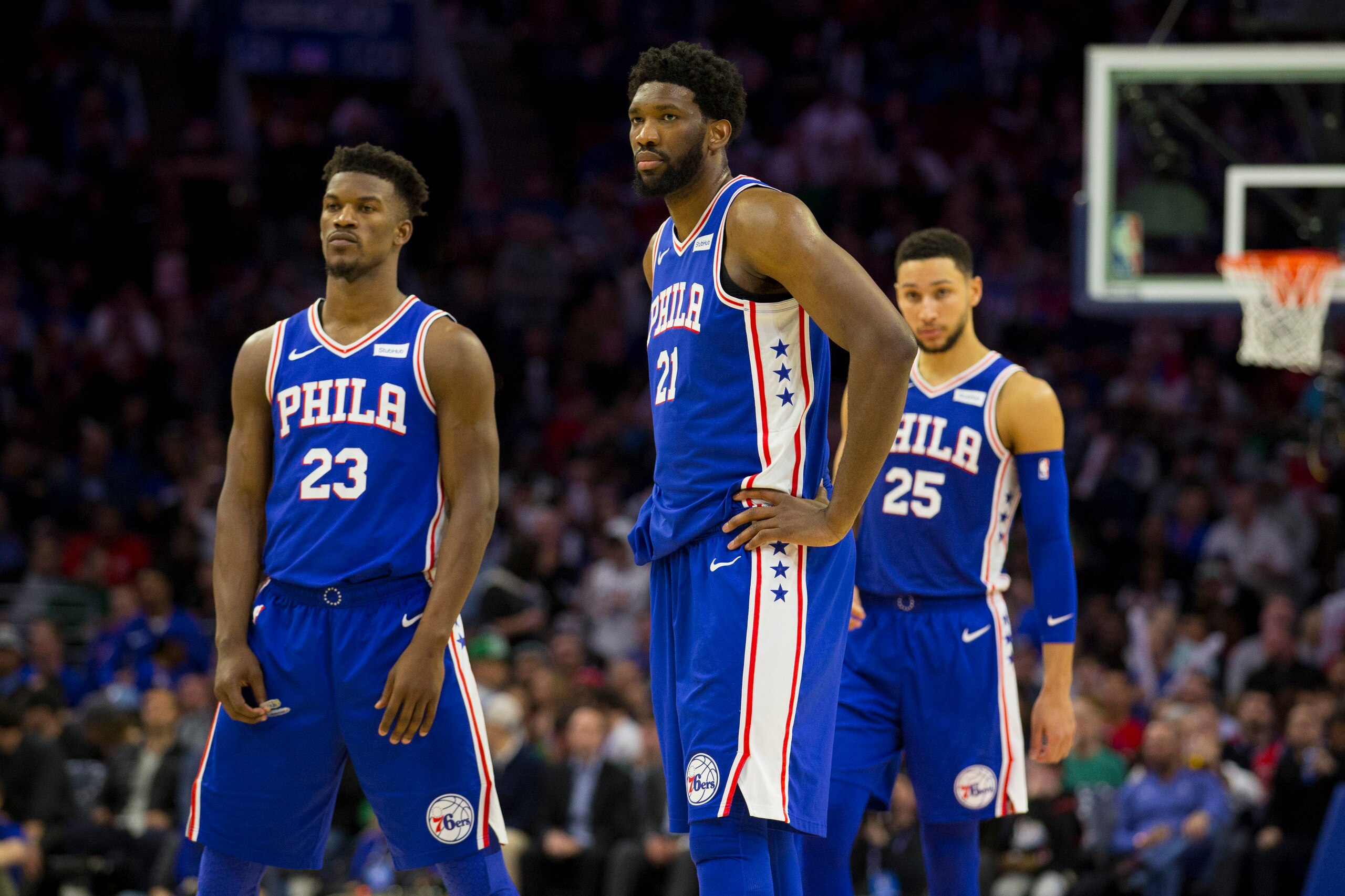 PHILADELPHIA, PA - MARCH 20: Jimmy Butler #23, Joel Embiid #21, and Ben Simmons #25 of the Philadelphia 76ers look on against the Boston Celtics in the third quarter at the Wells Fargo Center on March 20, 2019 in Philadelphia, Pennsylvania. The 76ers defe