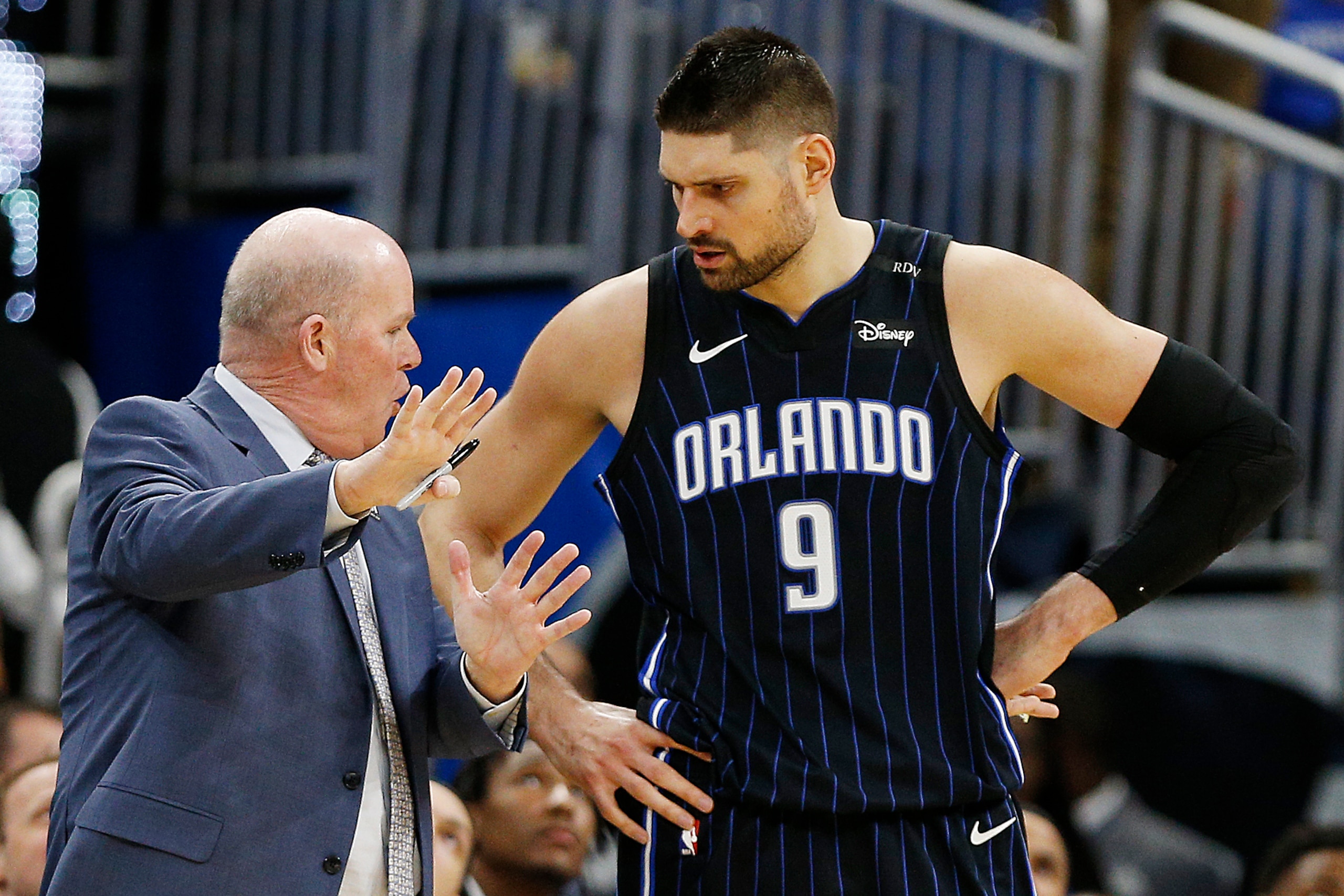 ORLANDO, FLORIDA - JANUARY 29:  Nikola Vucevic #9 of the Orlando Magic talks with head coach Steve Clifford of the Orlando Magic against the Oklahoma City Thunder during the second half at Amway Center on January 29, 2019 in Orlando, Florida. NOTE TO USER