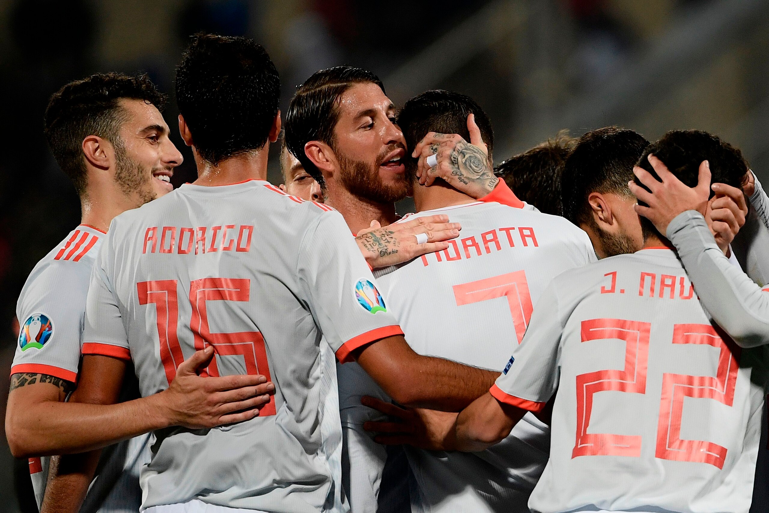 Spain's defender Sergio Ramos (C) embraces Spain's forward Alvaro Morata after he scored during the Euro 2020 Group F qualifying football match Malta vs Spain on March 26, 2019 at the Ta' Qali Stadium in Malta. (Photo by Filippo MONTEFORTE / AFP)        (