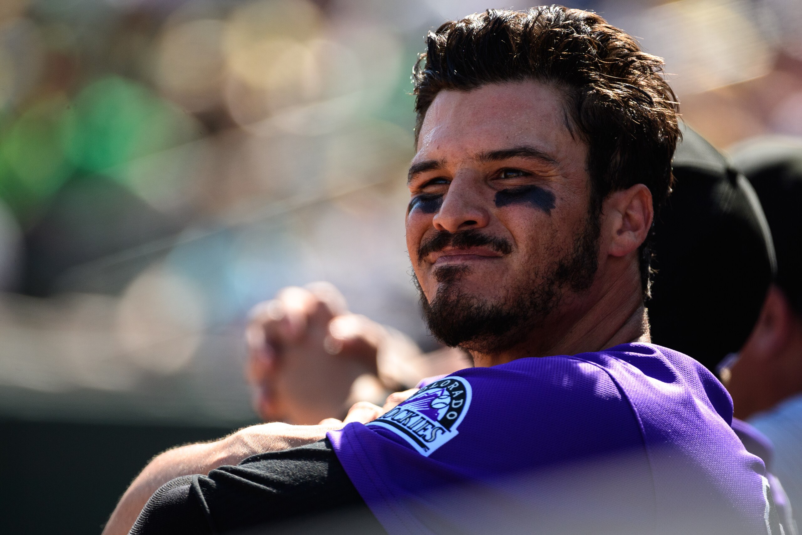 MESA, ARIZONA - MARCH 01: Nolan Arenado #28 of the Colorado Rockies looks on from the dugout during the spring training game against the Oakland Athletics at HoHoKam Stadium on March 01, 2019 in Mesa, Arizona. (Photo by Jennifer Stewart/Getty Images)