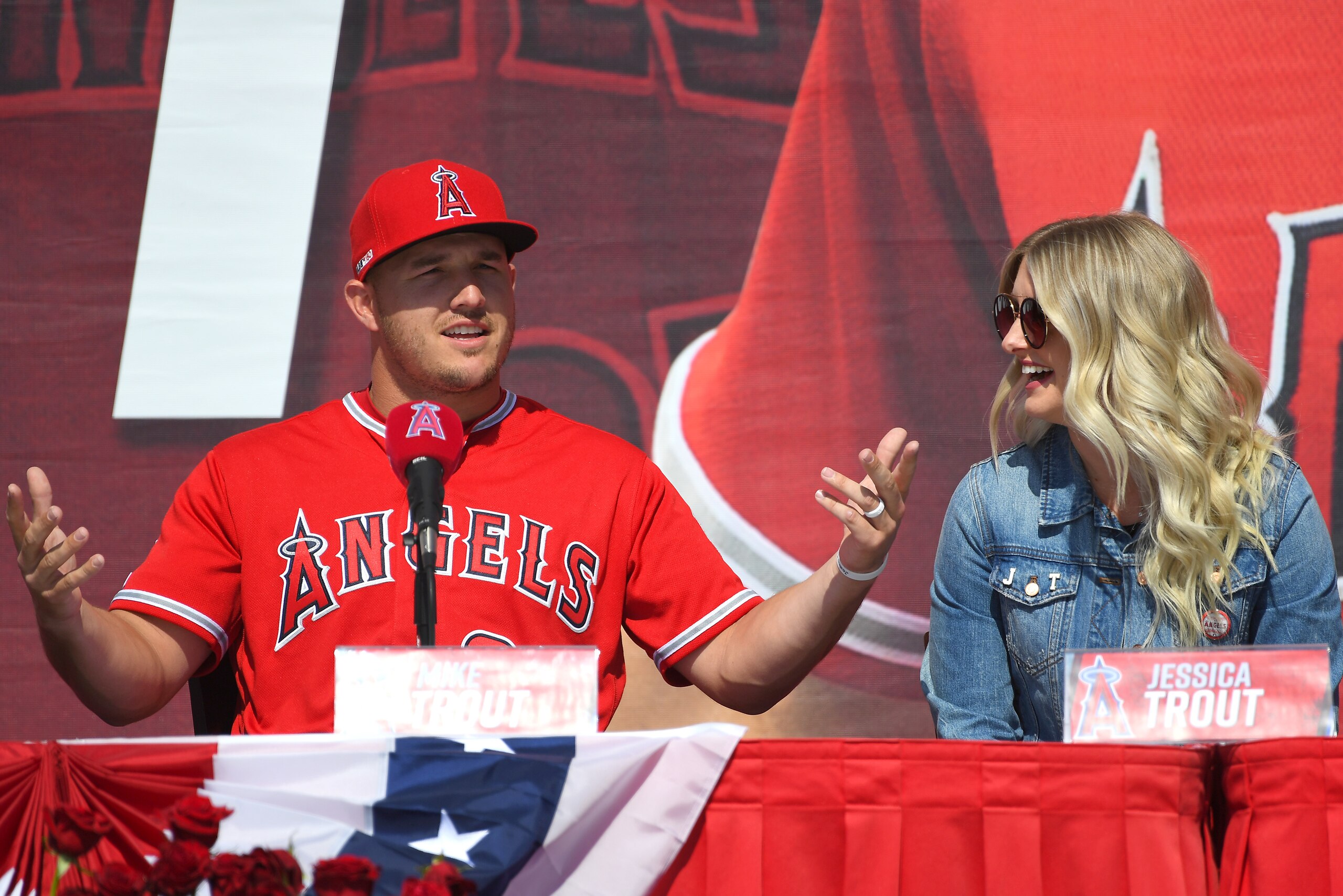 ANAHEIM, CA - MARCH 24: Mike Trout #27 of the Los Angeles Angels of Anaheim, sits with his wife Jessica Trout as he attends a press conference after agreeing to the terms of a 12-year, $430 million contract extension at Angel Stadium of Anaheim on March 2