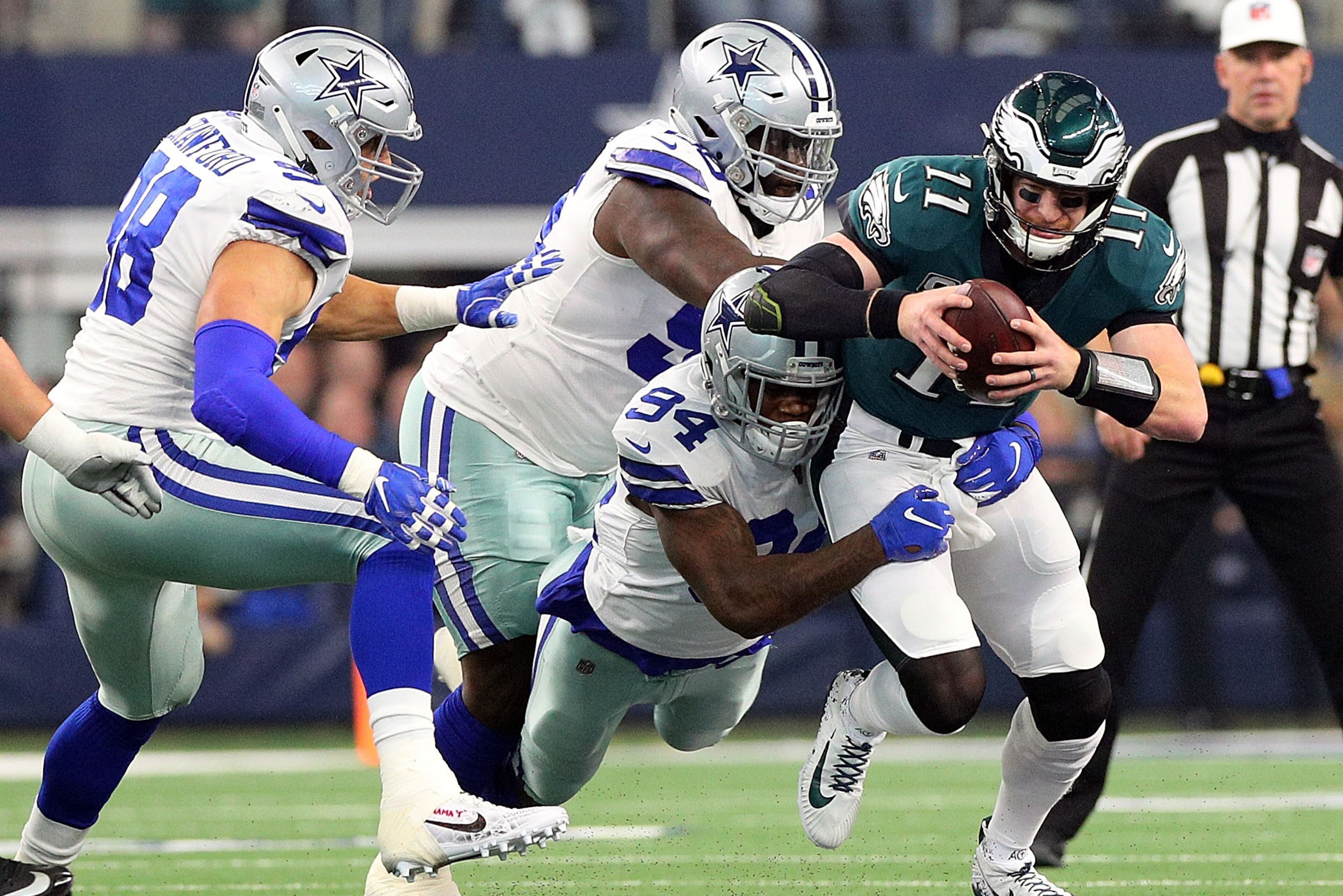 ARLINGTON, TEXAS - DECEMBER 09: Randy Gregory #94, Maliek Collins #96, and Tyrone Crawford #98 of the Dallas Cowboys sack Carson Wentz #11 of the Philadelphia Eagles in the first quarter at AT&T Stadium on December 09, 2018 in Arlington, Texas. (Photo b ARLINGTON, TEXAS - DECEMBER 09: Randy Gregory #94, Maliek Collins #96, and Tyrone Crawford #98 of the Dallas Cowboys sack Carson Wentz #11 of the Philadelphia Eagles in the first quarter at AT&T Stadium on December 09, 2018 in Arlington, Texas. (Photo b