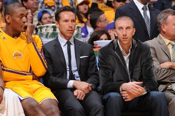 LOS ANGELES, CA - APRIL 26:  Darius Morris #1, Metta World Peace #15, Steve Nash #10 and Steve Blake #5 of the Los Angeles Lakers sit on the bench during the game against the San Antonio Spurs at Staples Center in Game Three of the Western Conference Quar