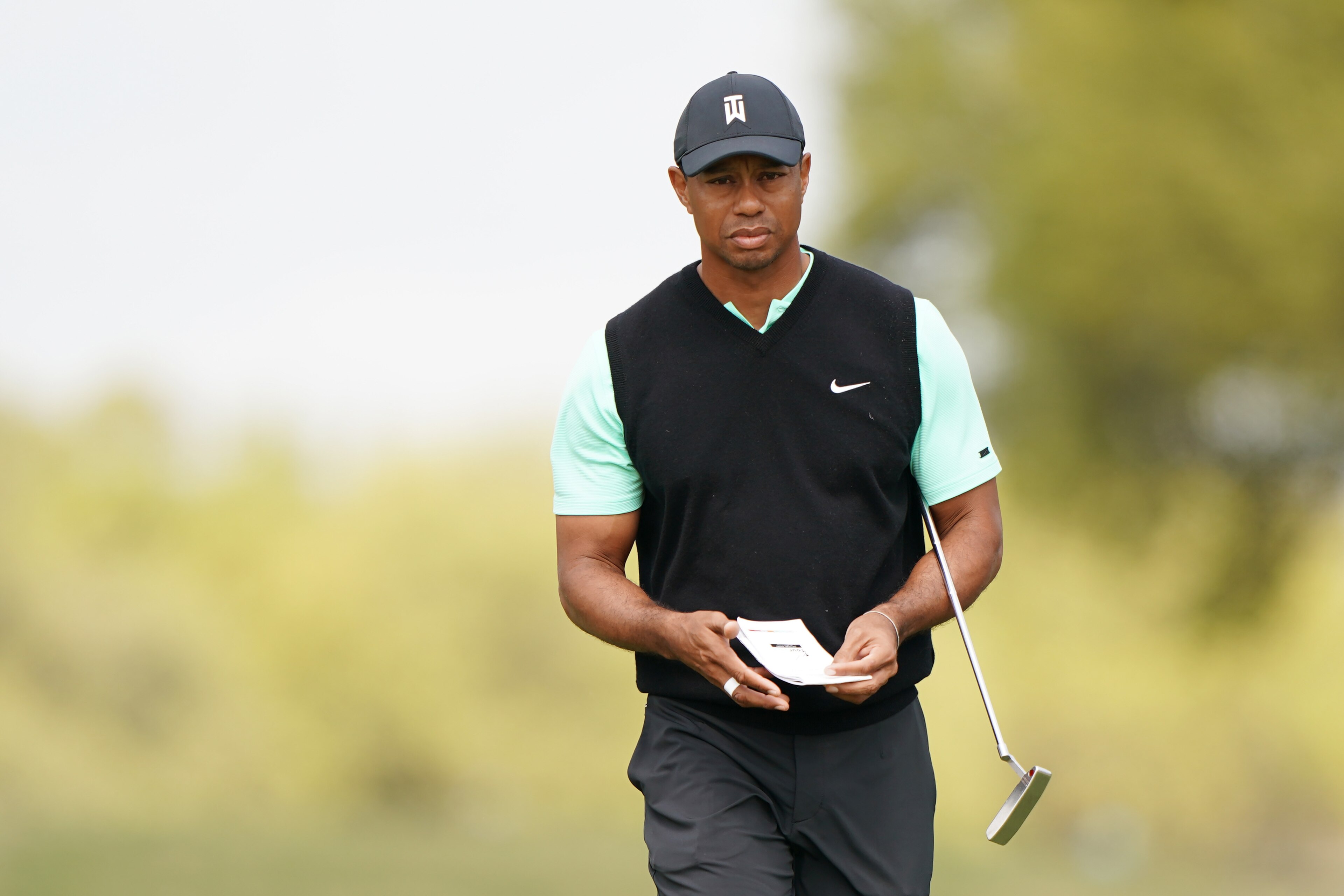 AUSTIN, TEXAS - MARCH 28: Tiger Woods of the United States walks on the first green in his match against Brandt Snedeker of the United States during the second round of the World Golf Championships-Dell Technologies Match Play at Austin Country Club on Ma