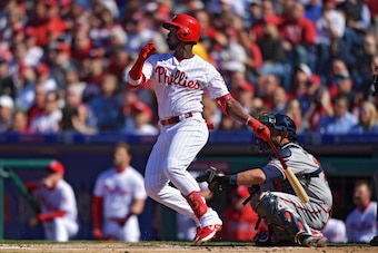 PHILADELPHIA, PA - MARCH 28: Andrew McCutchen #22 of the Philadelphia Phillies hits a home run on his first at bat in the first inning against the Atlanta Braves on Opening Day at Citizens Bank Park on March 28, 2019 in Philadelphia, Pennsylvania. (Photo 
