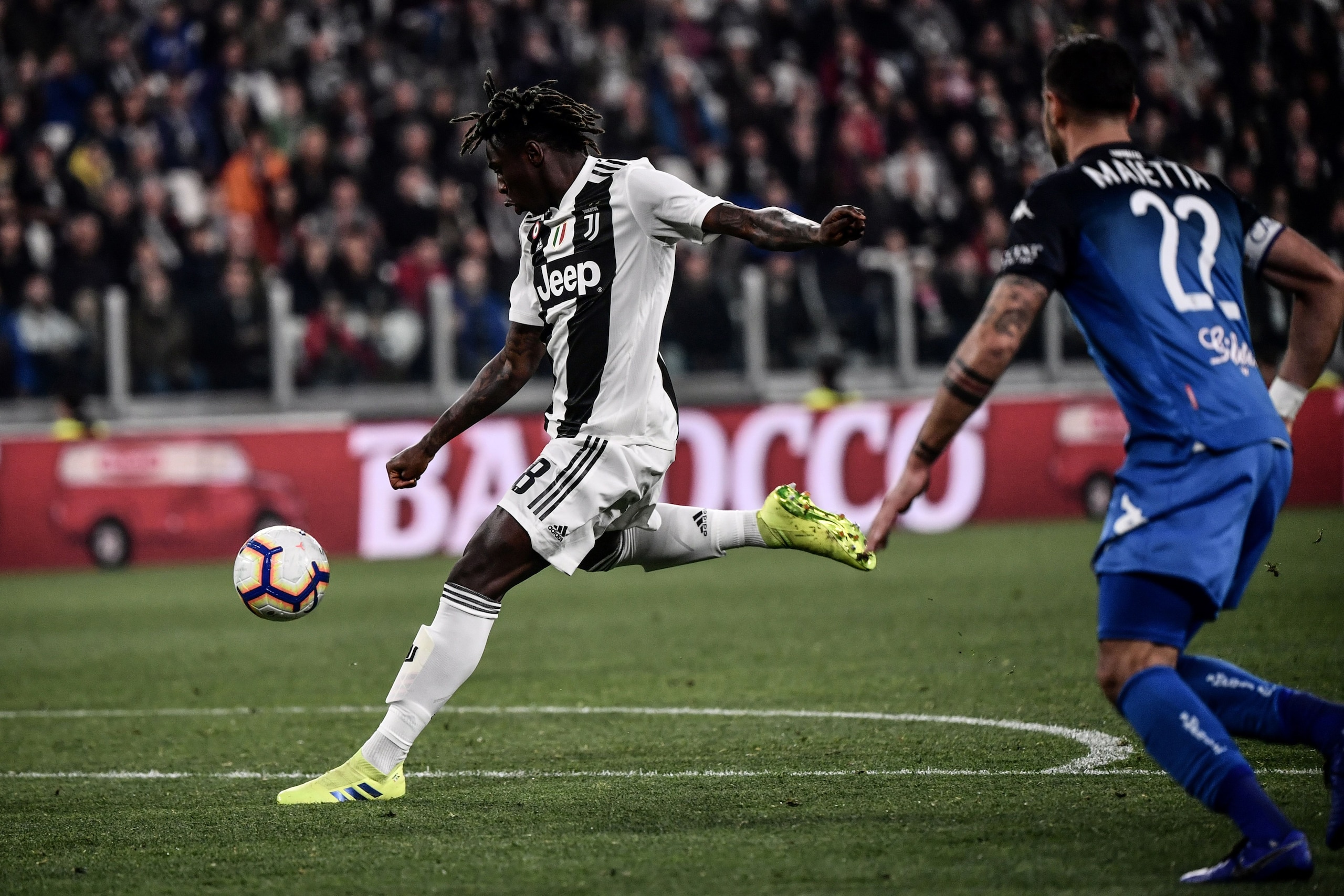 Juventus' Italian forward Moise Kean shoots to open the scoring during the Italian Serie A football match Juventus vs Empoli on March 30, 2019 at the Juventus stadium in Turin. (Photo by Marco BERTORELLO / AFP)        (Photo credit should read MARCO BERTO