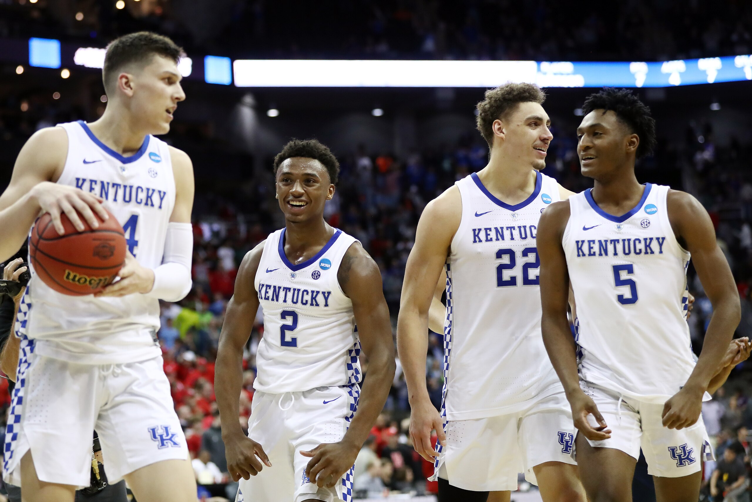 KANSAS CITY, MISSOURI - MARCH 29: (L-R) Tyler Herro #14, Ashton Hagans #2, Reid Travis #22 of the Kentucky Wildcats and Immanuel Quickley #5 of the Kentucky Wildcats celebrate after defeating the Houston Cougars 62-58 during the 2019 NCAA Basketball Tourn